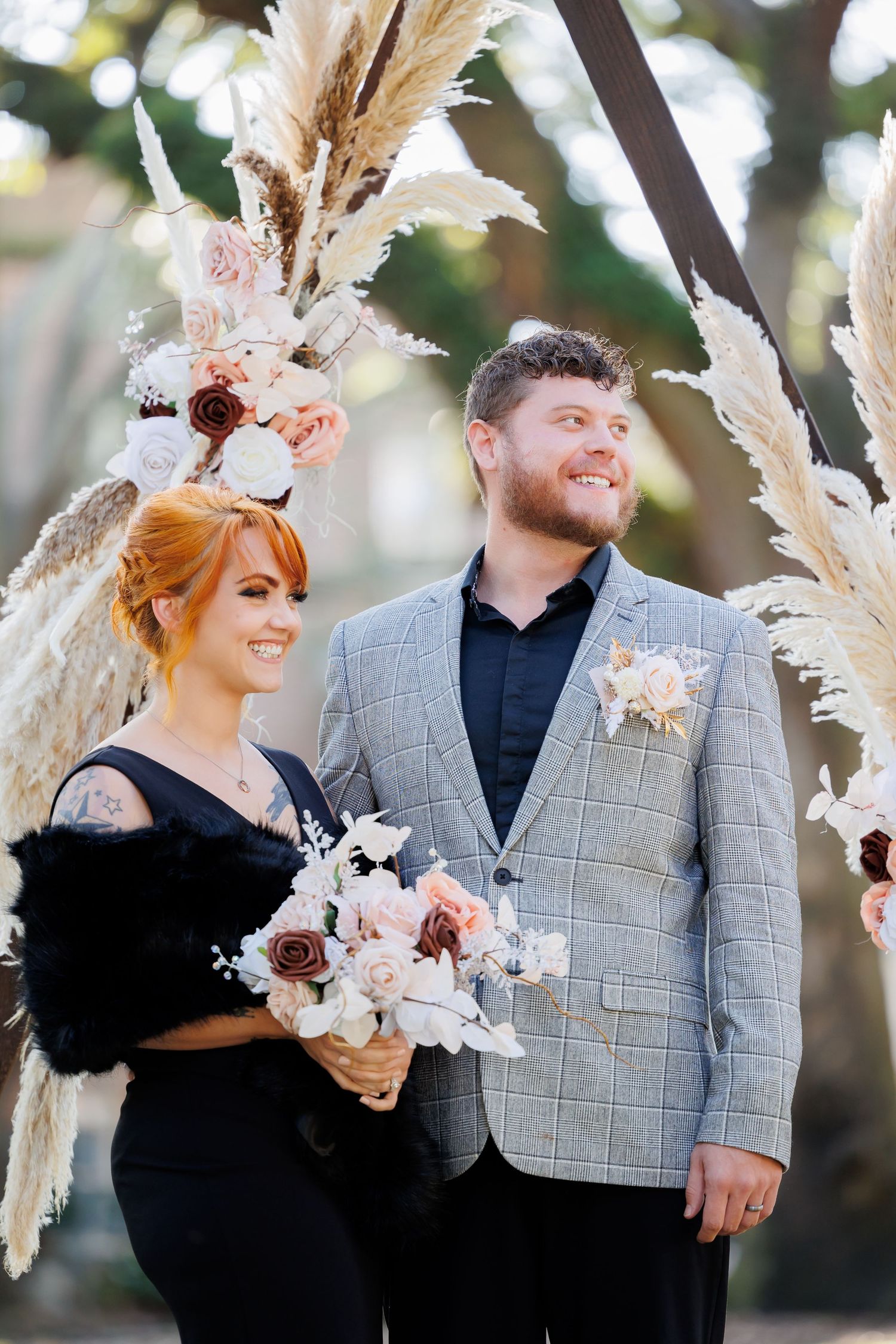 A beautiful boho wedding setting with the bride and groom in the historic Chatham Square, Savannah, Ga.