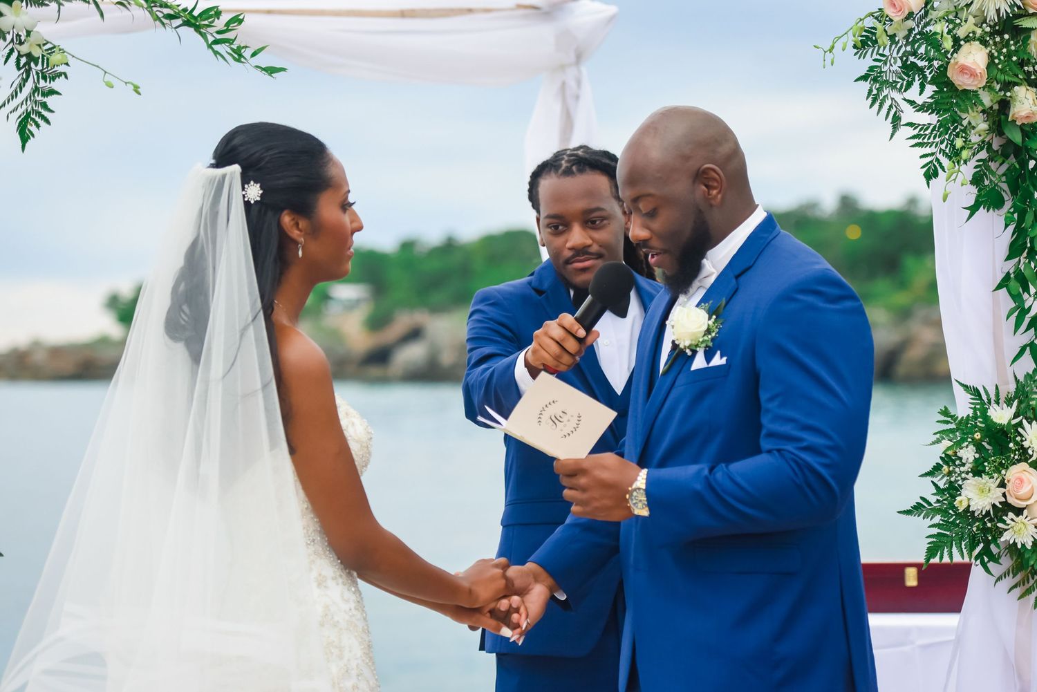 Intimate wedding ceremony moments with couple exchanging vows by the water.