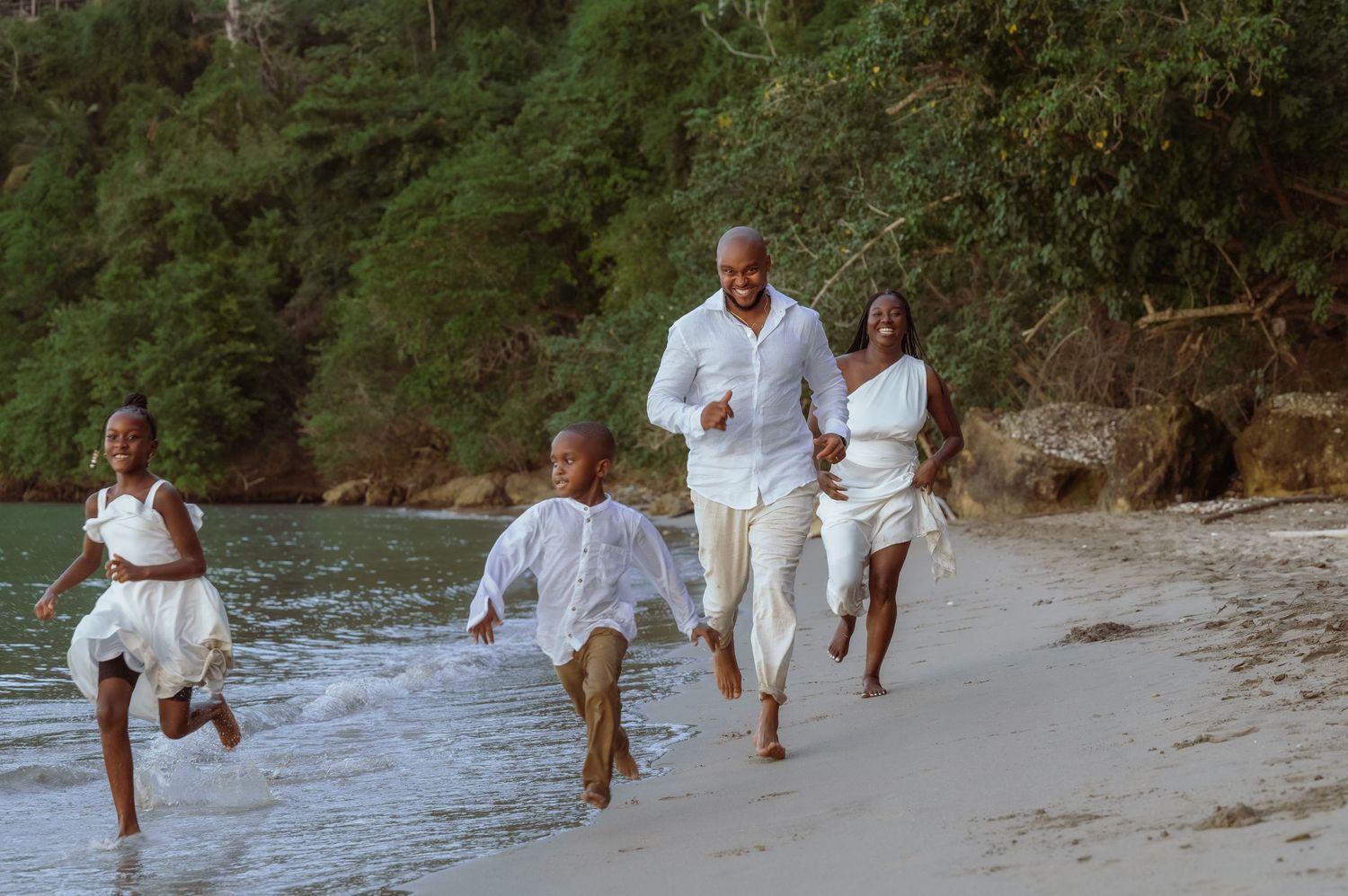 Joyful family moments captured while playing on a sandy beach.