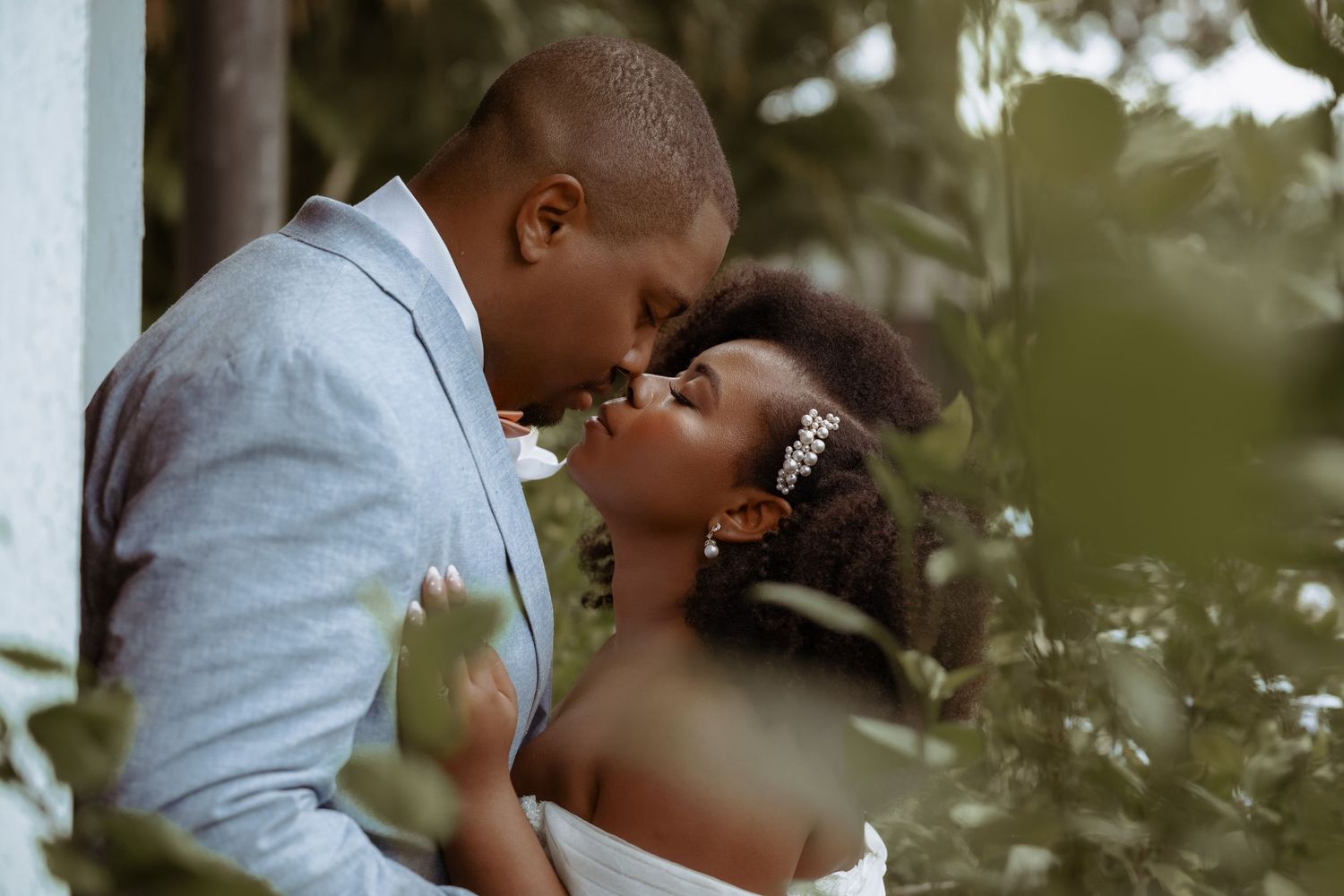 Romantic wedding moments captured in a lush garden setting with soft natural lighting.
