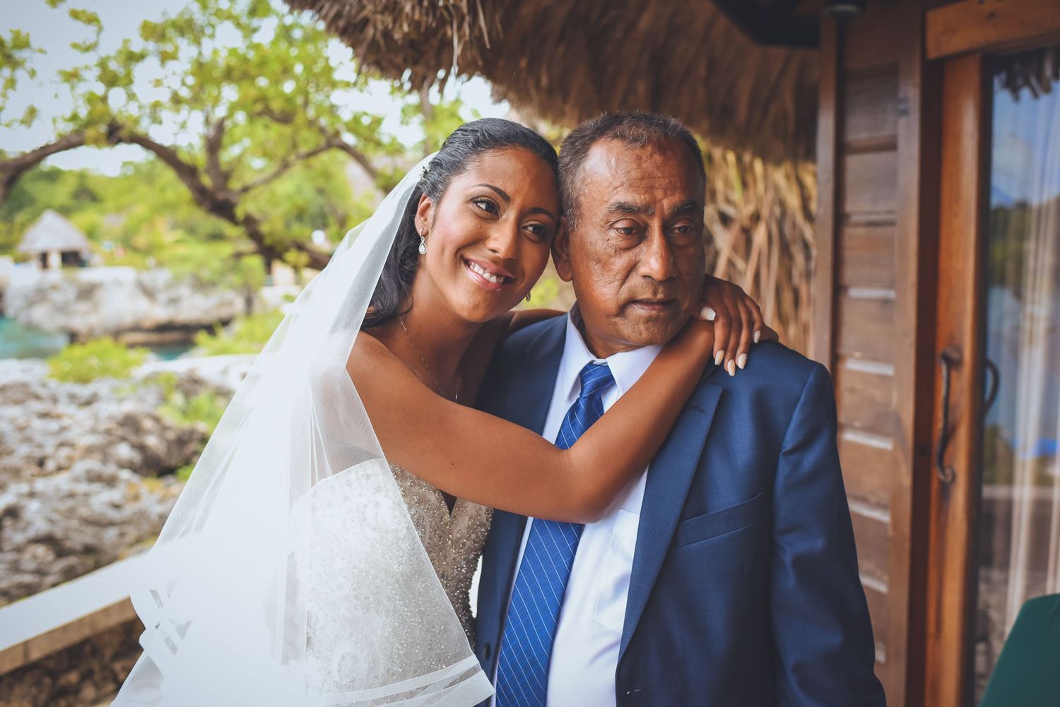 Romantic wedding photography session at a tropical resort with natural lighting.
