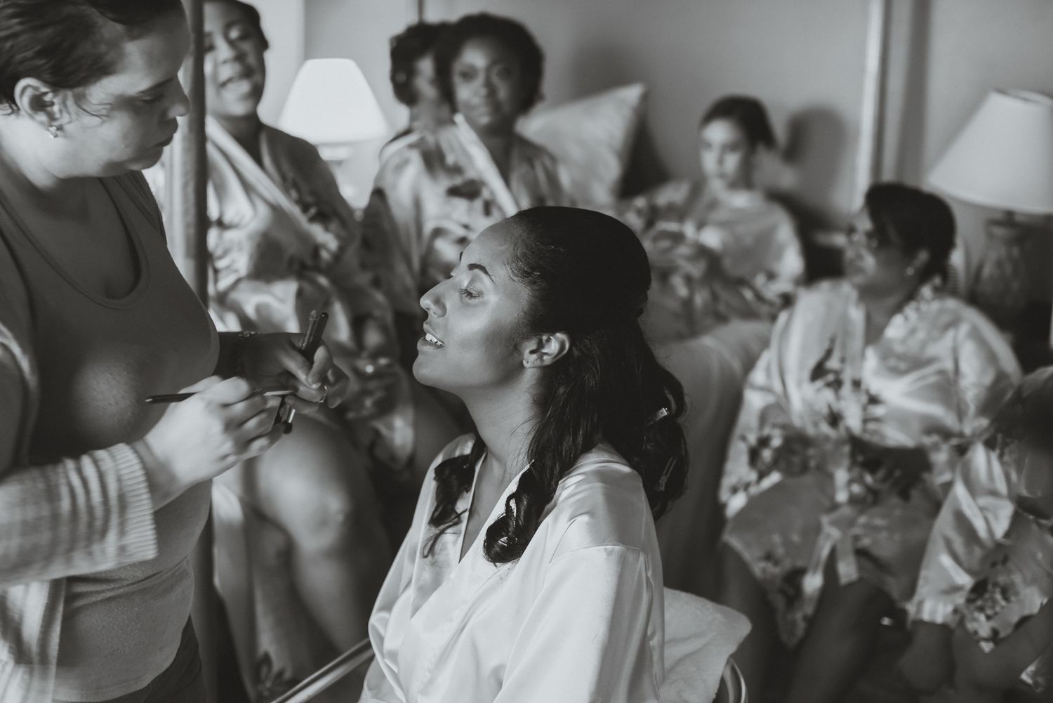 Wedding guests watching ceremony in black and white photography.