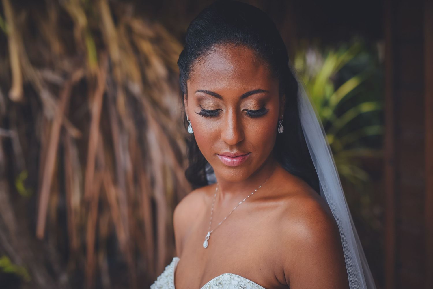 Close-up bridal portraits showcasing detailed lace dress and natural makeup.