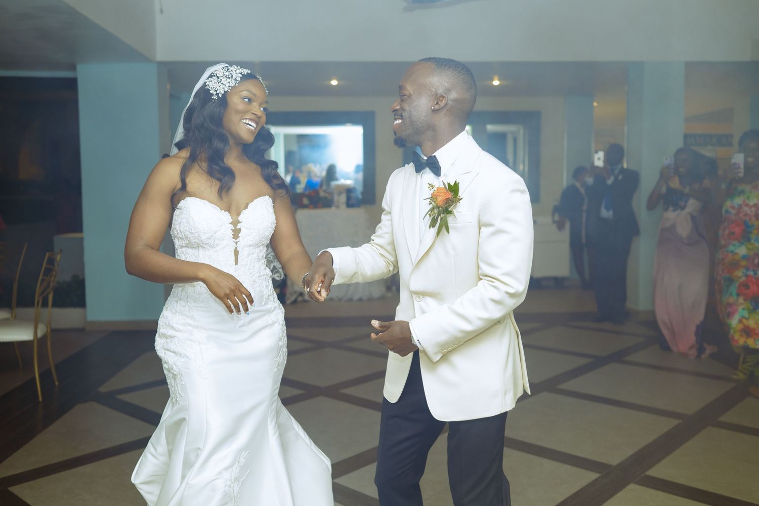 Wedding couple dancing and celebrating at their reception.