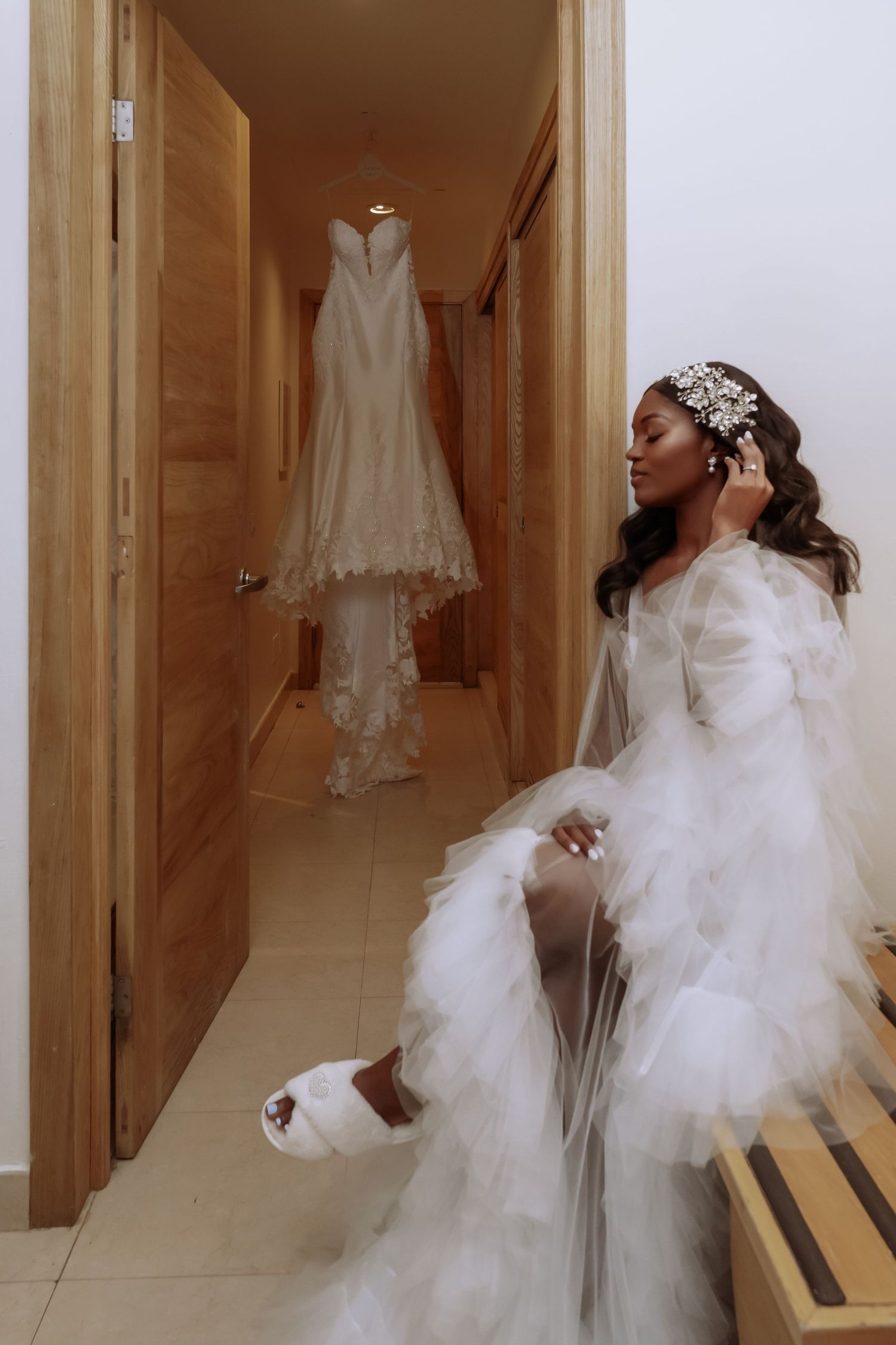 Ethereal bridal preparation scene with hanging dress and flowing white robe. Iberostar Montego Bay wedding