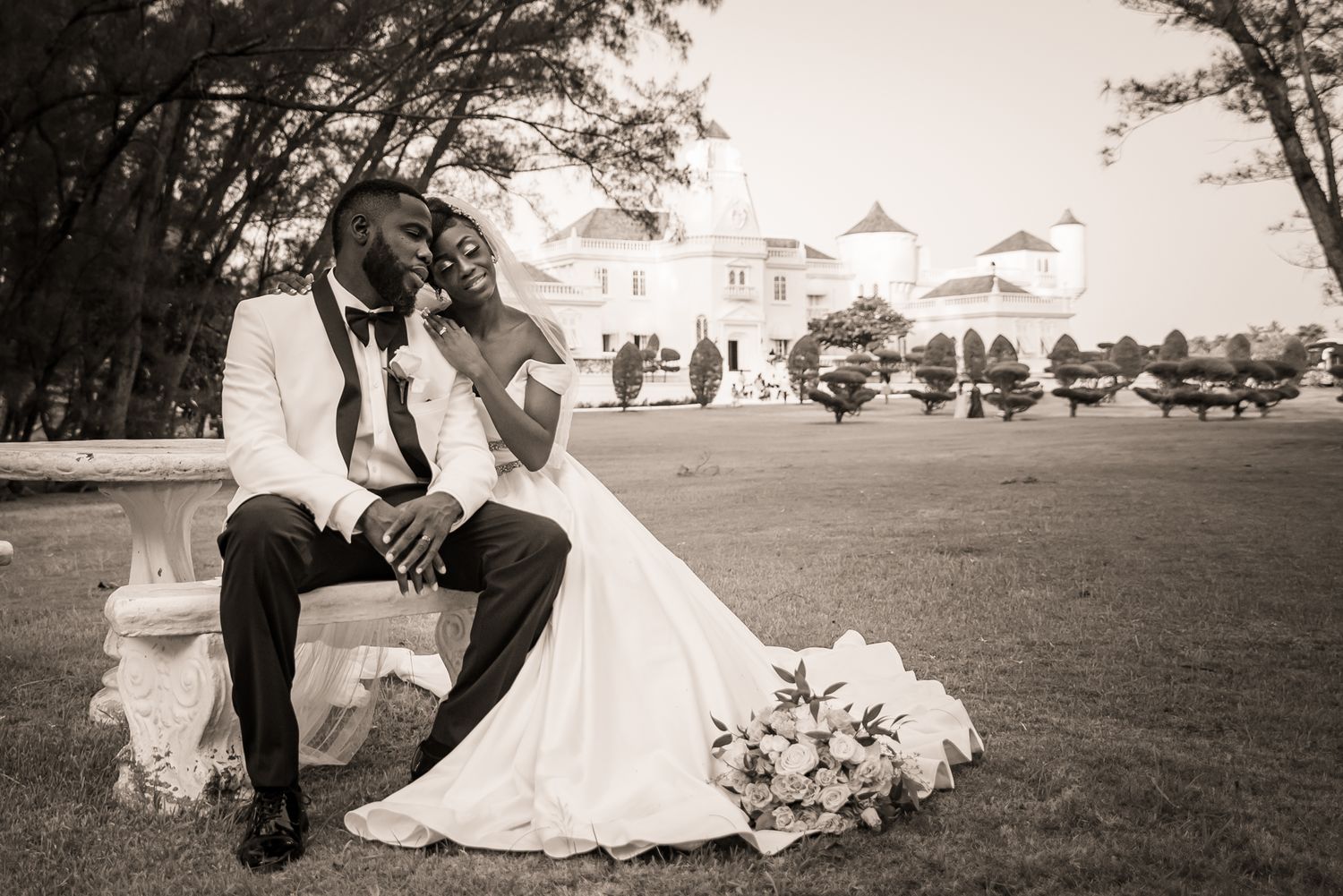 Wedding couple shares intimate moments in a series of black and white outdoor portraits.