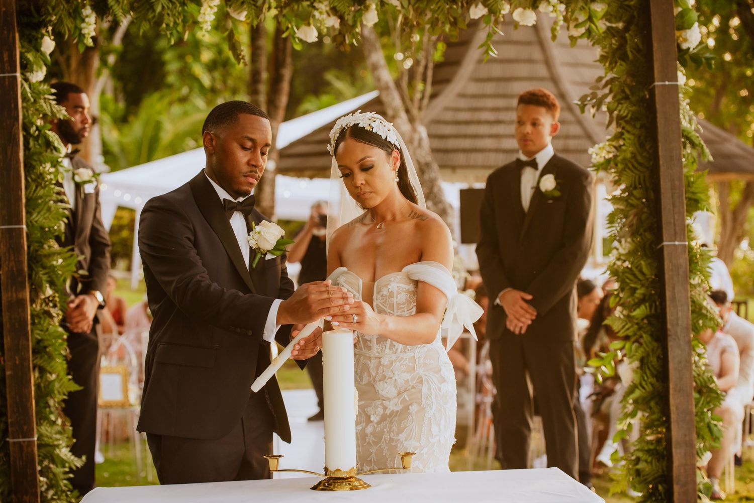 Wedding ceremony moments captured in outdoor garden setting with floral decorations.
