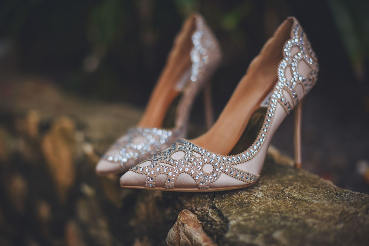 Close-up of sparkly bridal shoes with crystal embellishments.