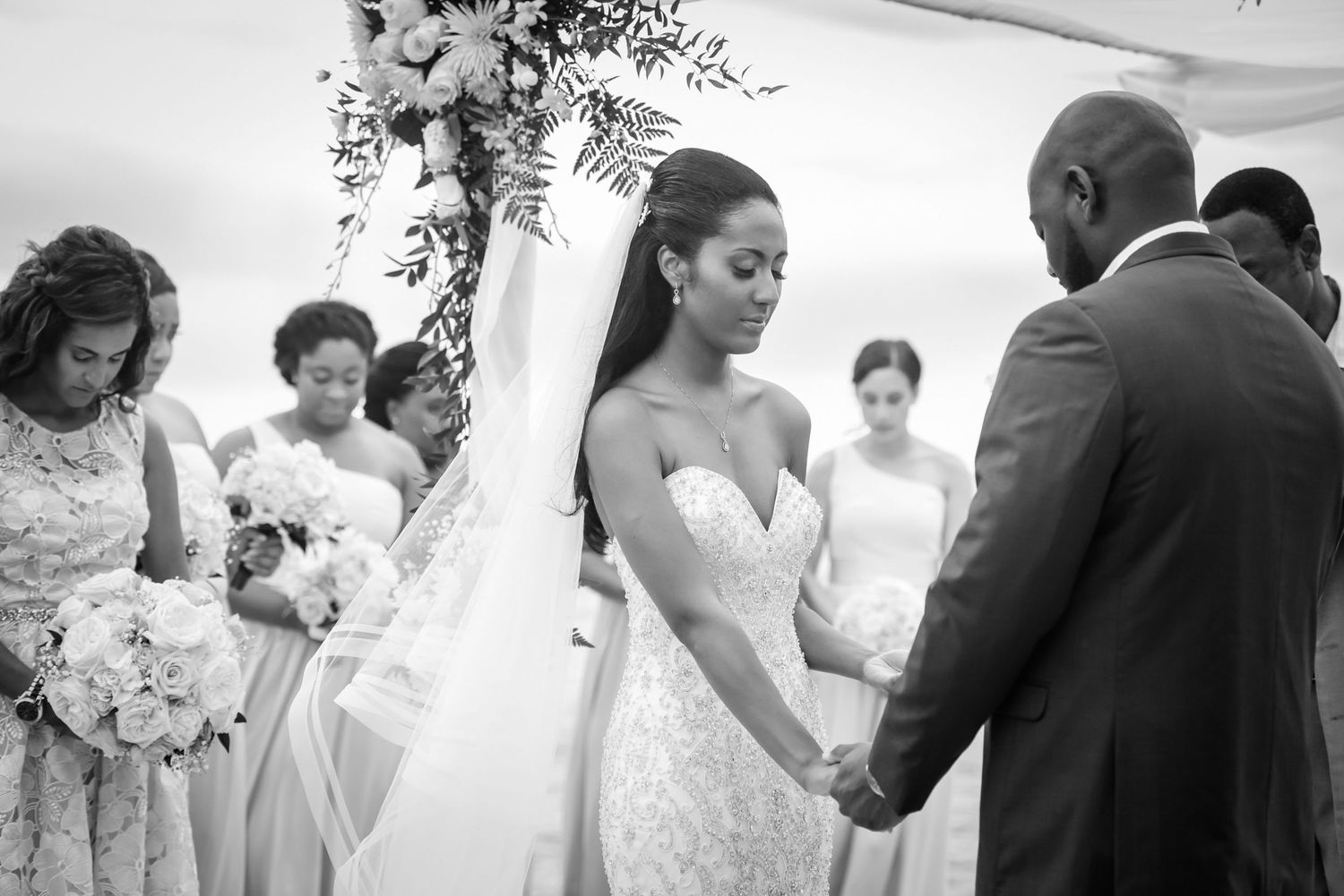 Black and white photo series capturing intimate wedding ceremony moments.