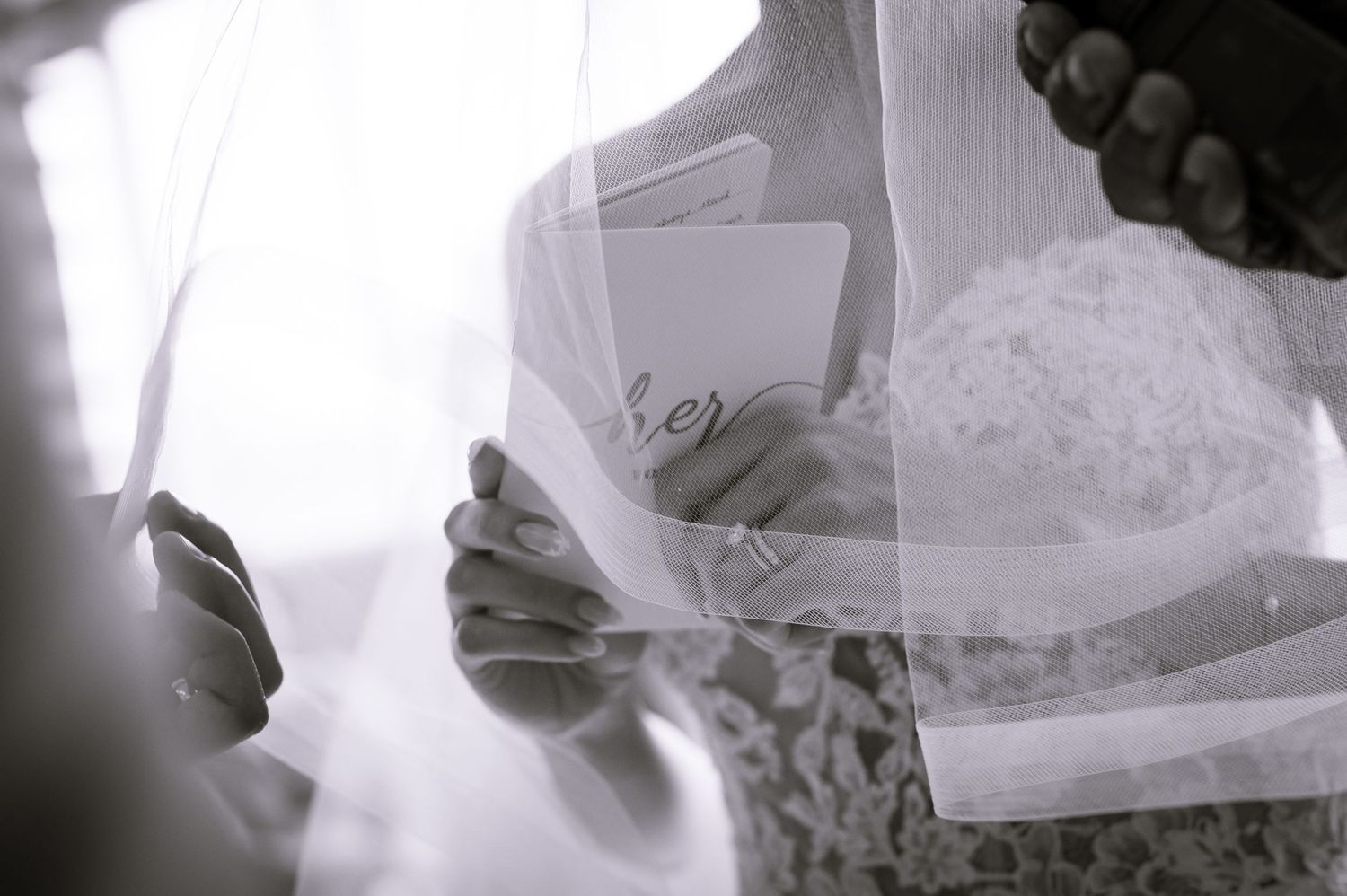 Black and white artistic shots of wedding ring exchange moments.