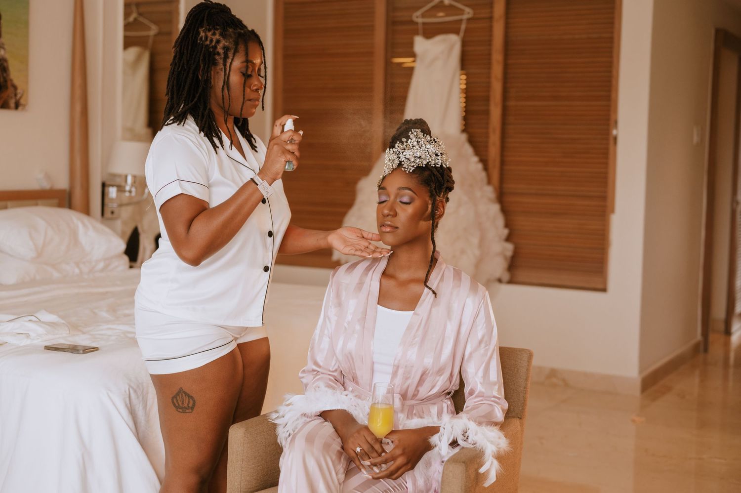 Wedding morning preparations with white robes and matching outfits.