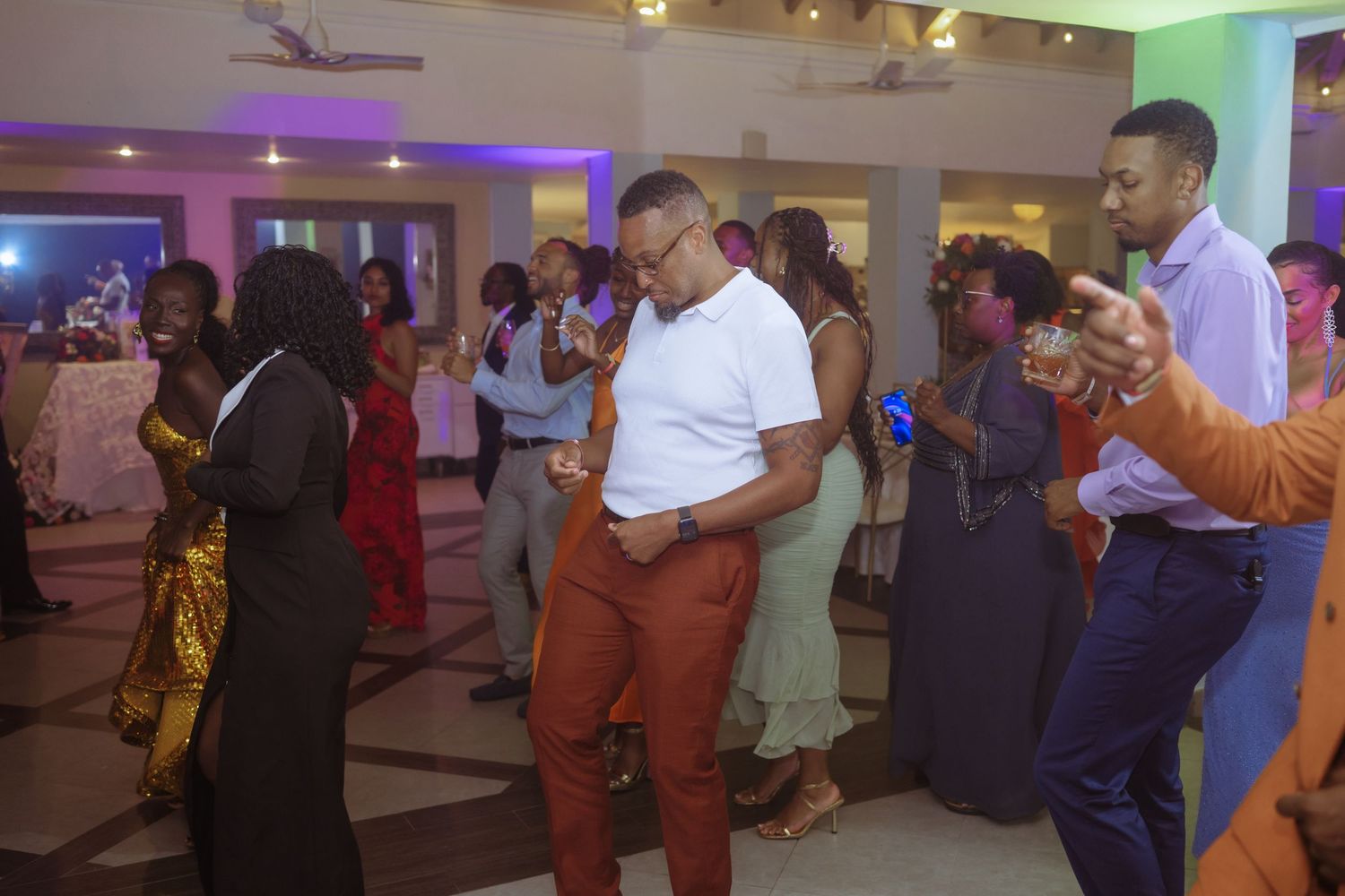Wedding reception dance floor filled with guests enjoying the celebration.