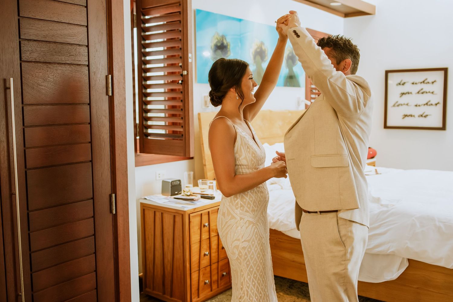Pre-ceremony preparations in a modern room with coastal-inspired decor and natural lighting.