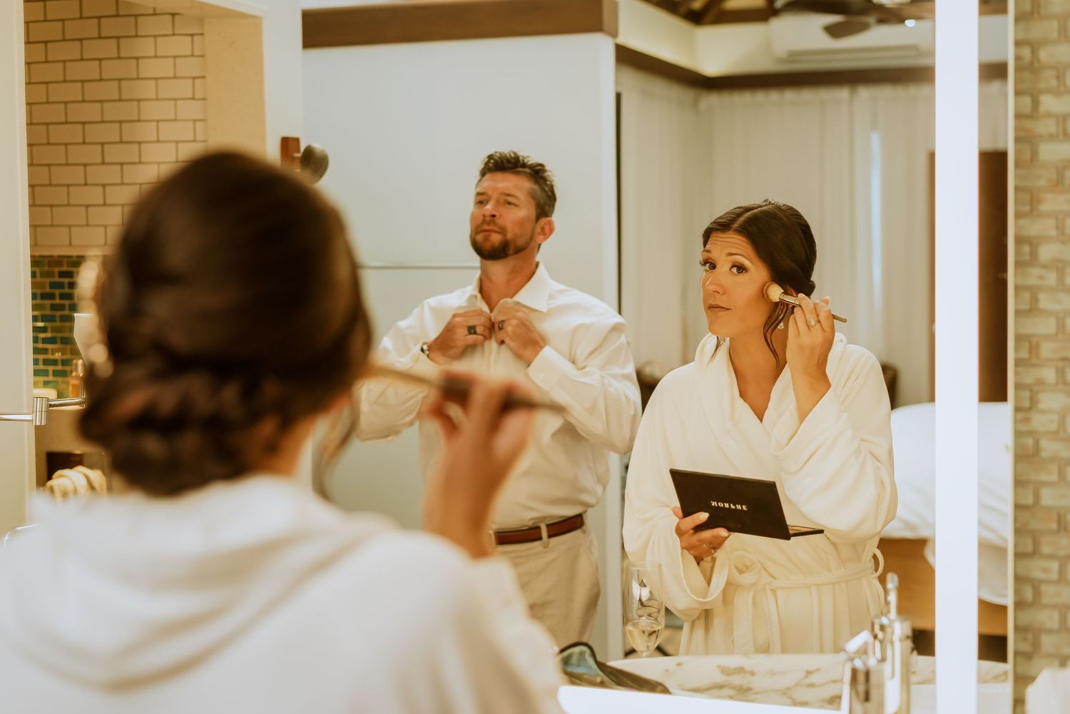 Wedding preparation scene in bright indoor venue with natural lighting.