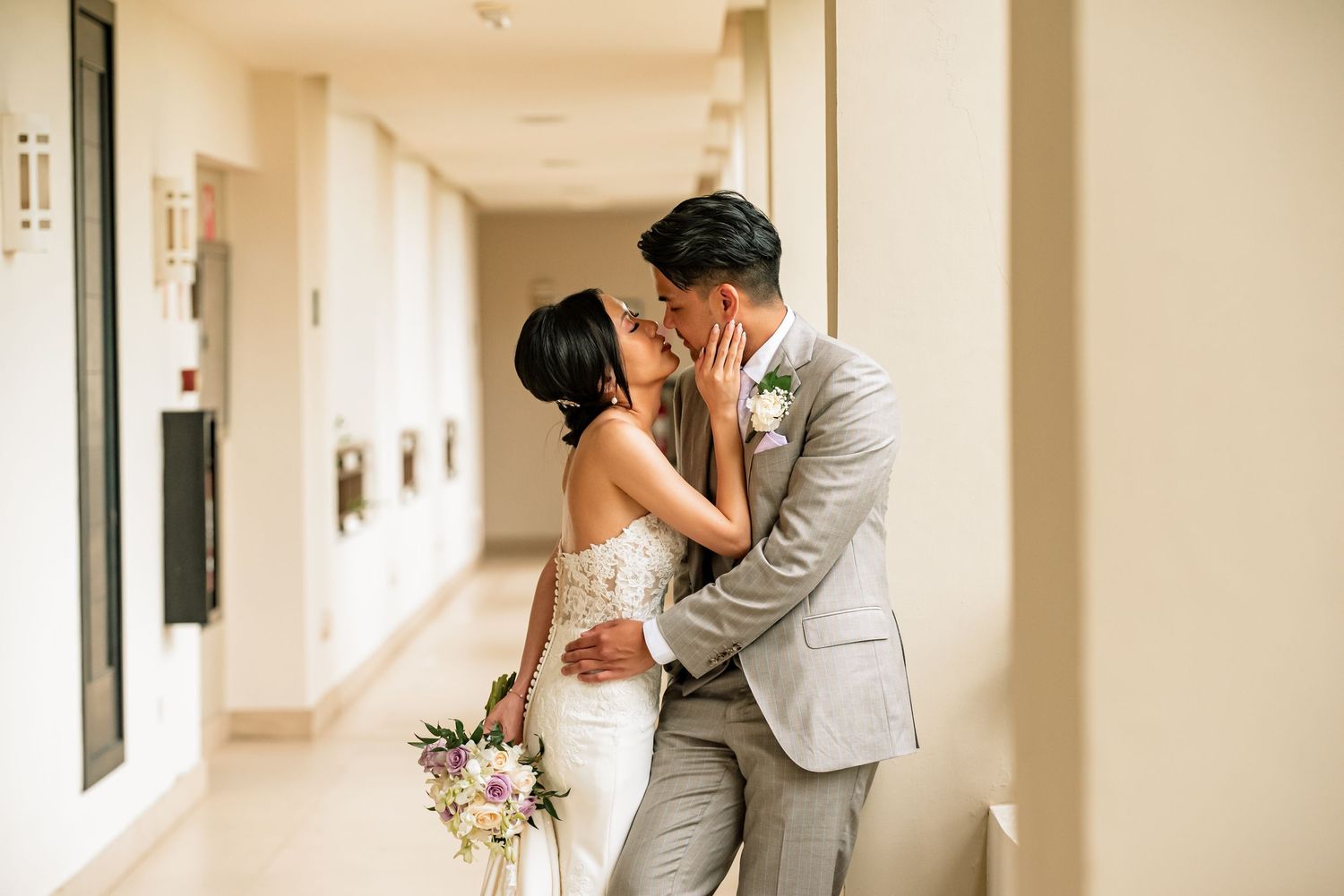 Romantic wedding photography sequence showing tender moments in a hallway.