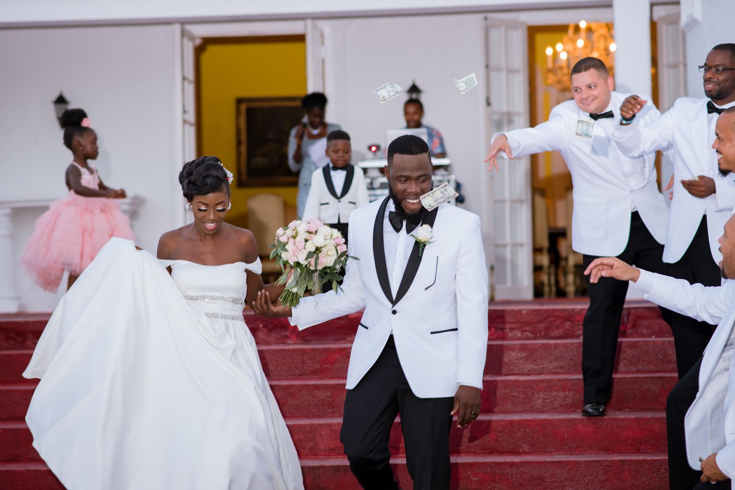 Wedding reception dance floor with formal attire and celebration.