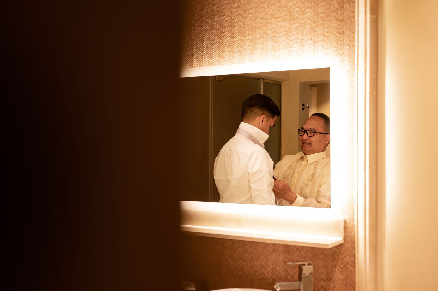 Multiple mirror reflections create artistic wedding preparation scene.