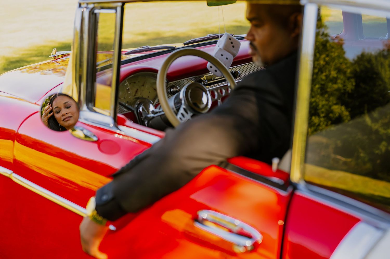 Classic red vintage car photographed from multiple angles in bright sunlight.