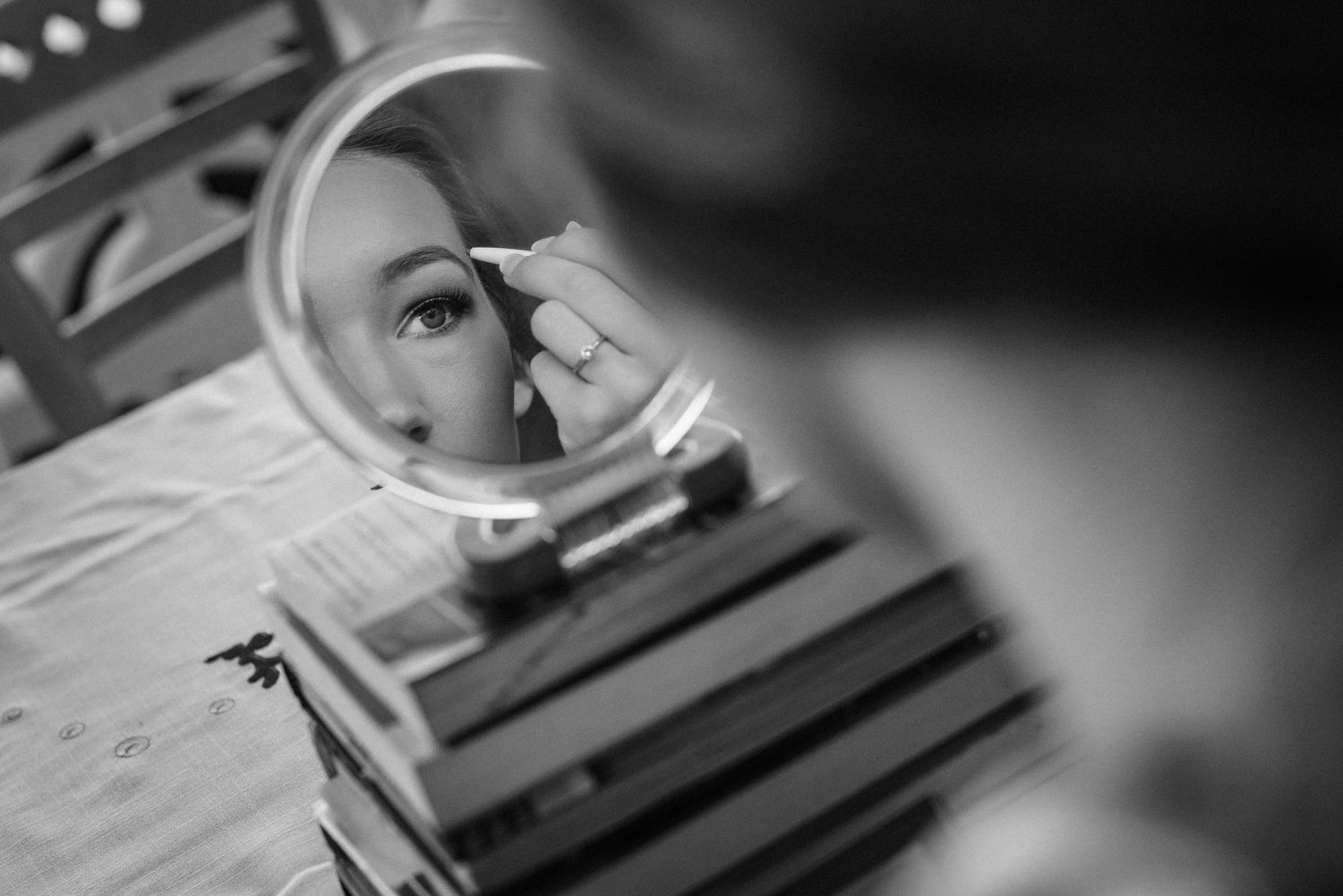 Black and white artistic detail shots of wedding preparation moments.