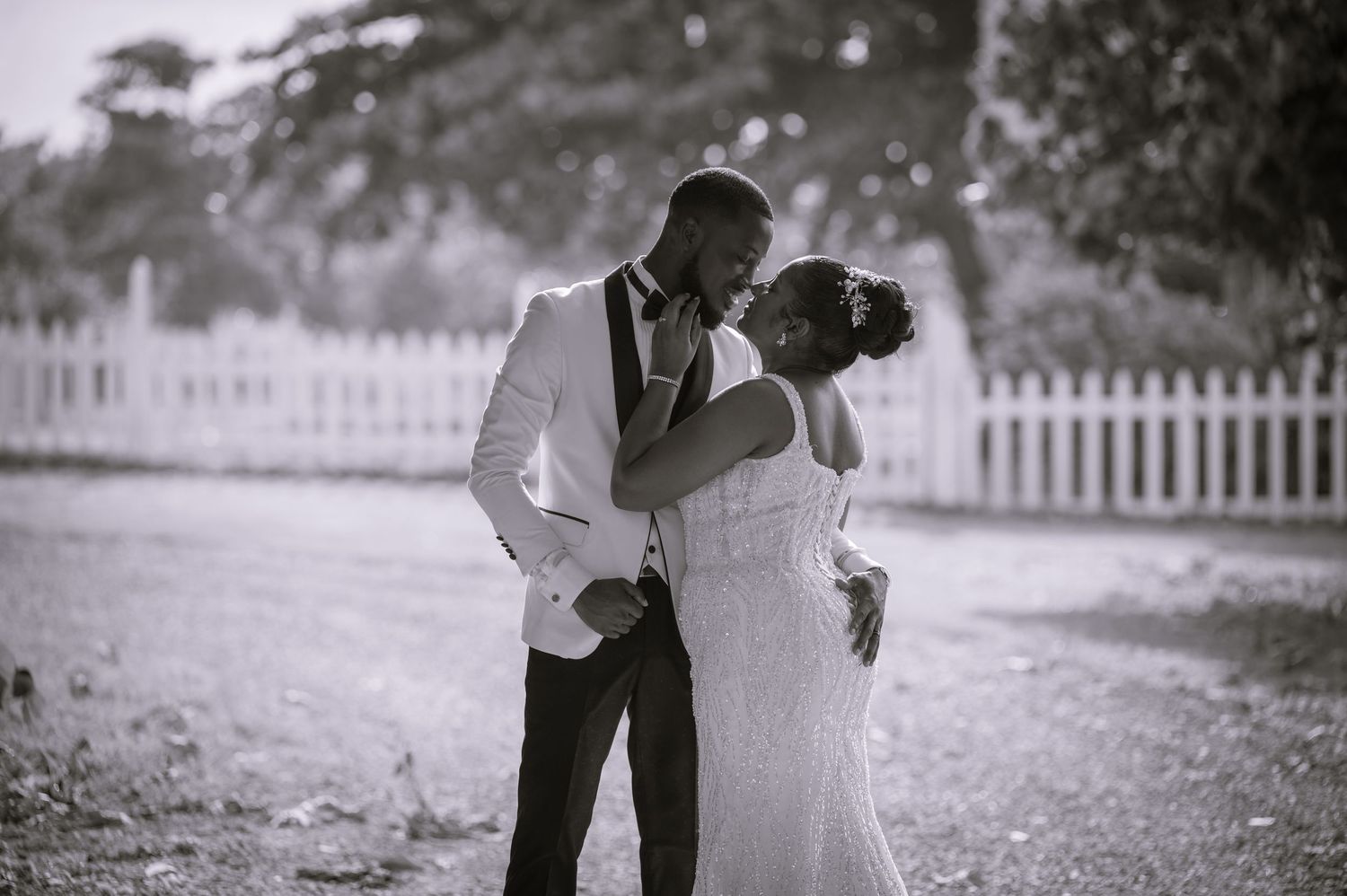 Black and white wedding portraits showing intimate moments between newlyweds.