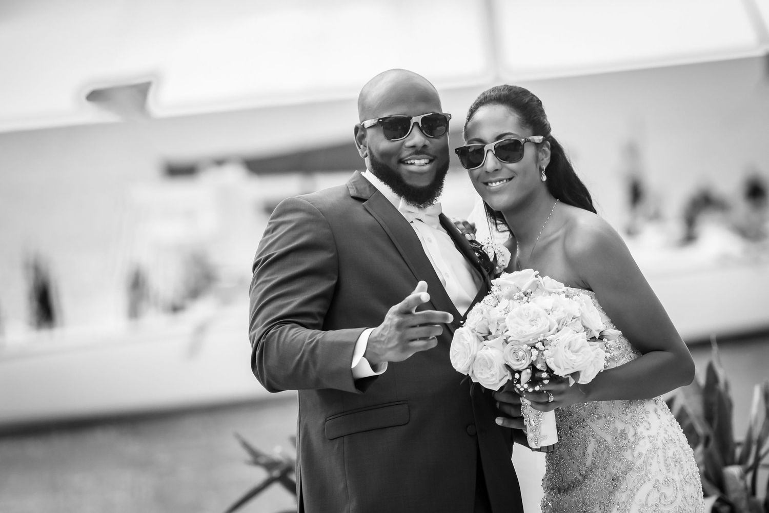 Black and white photo of wedding celebration moments at beach ceremony.