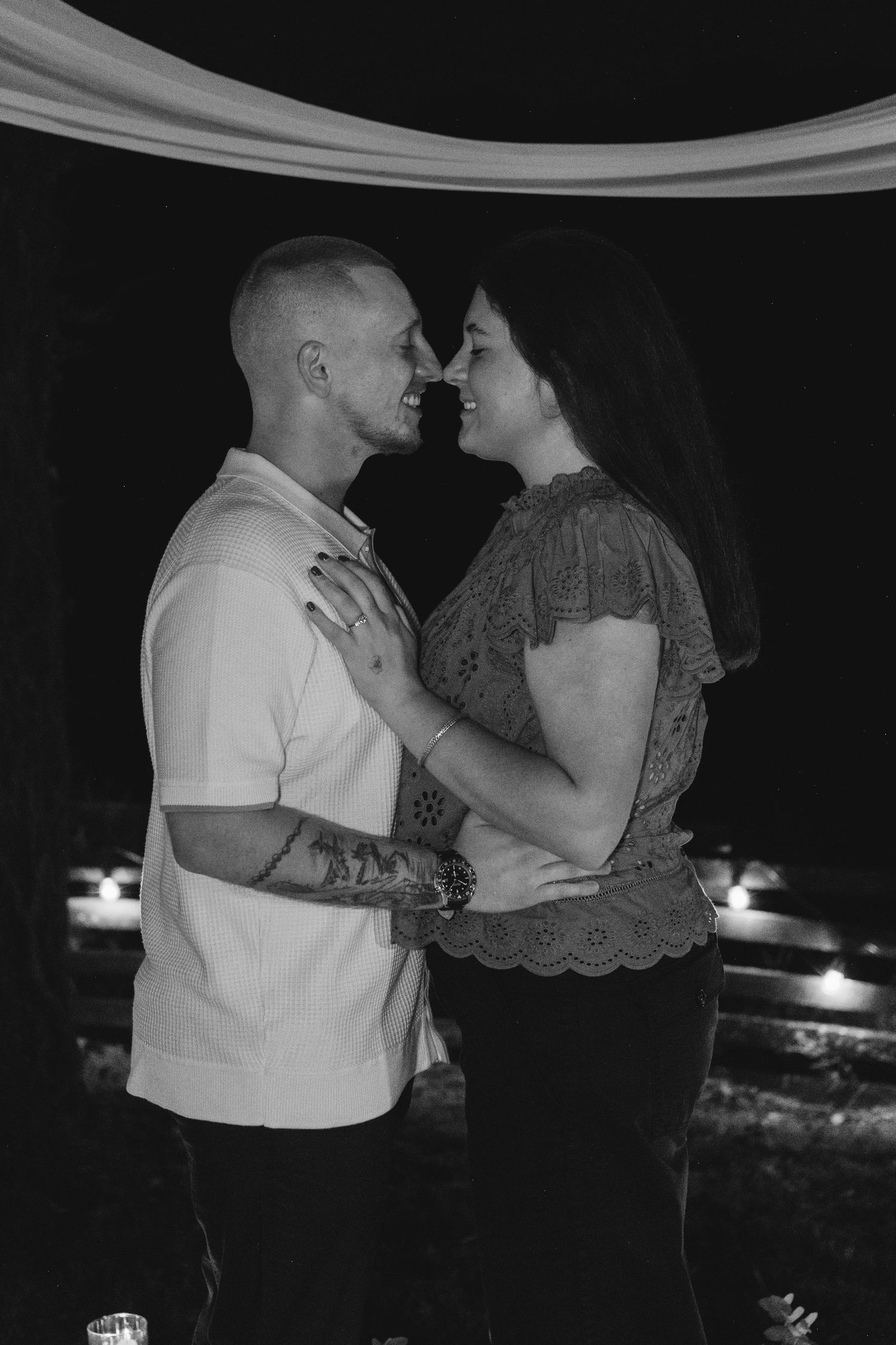 Romantic black and white nighttime couple portraits showing intimate moments.