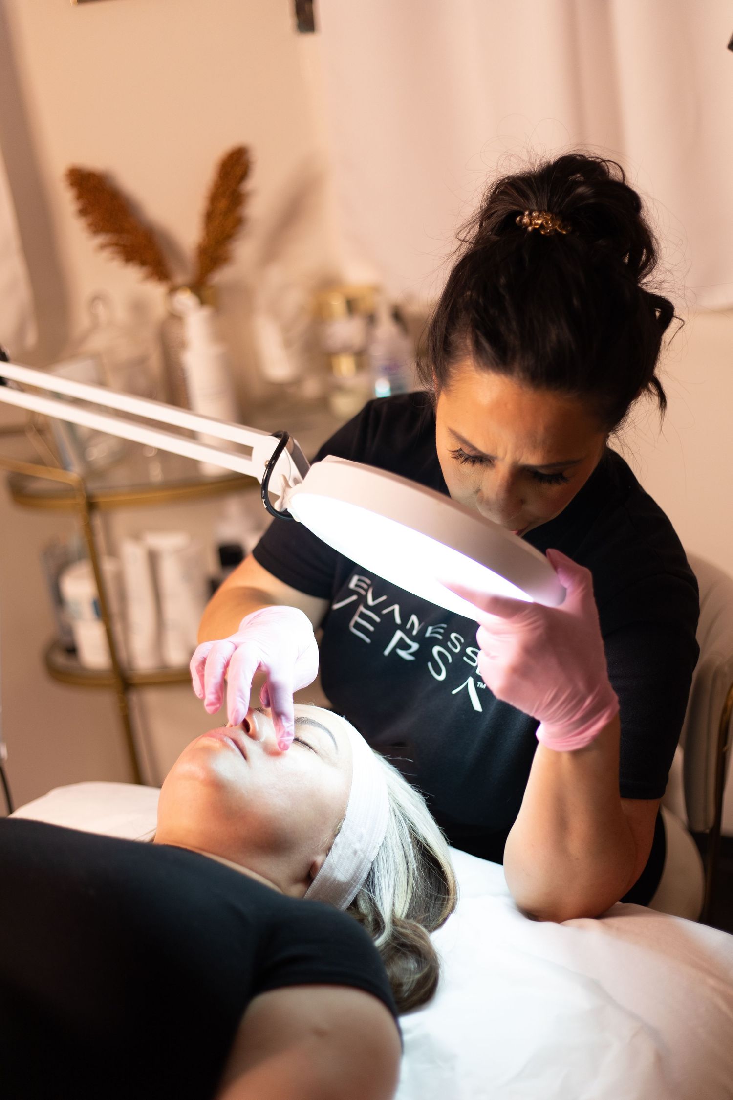 Close-up shots of hands performing detailed aesthetic treatment procedures with medical tools.
