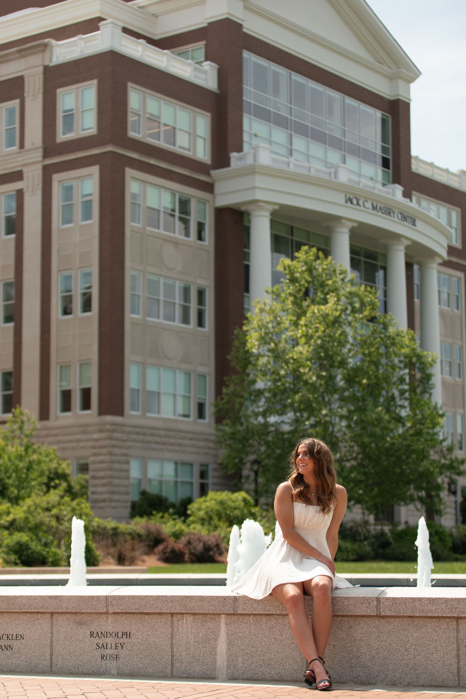Architectural photo series showing student poses at modern university building with columns.