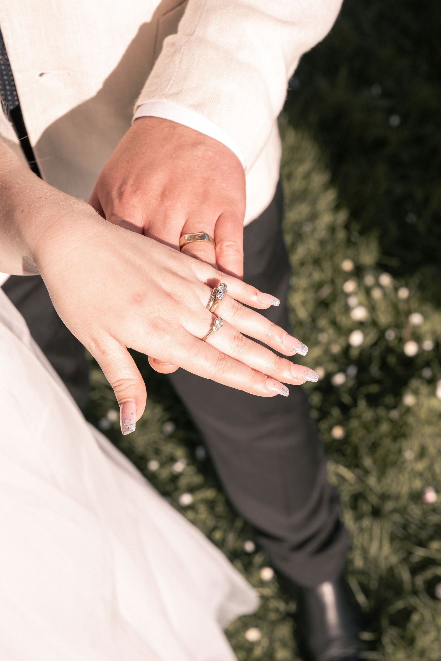 Close-up of wedding rings during wedding photoshoot.