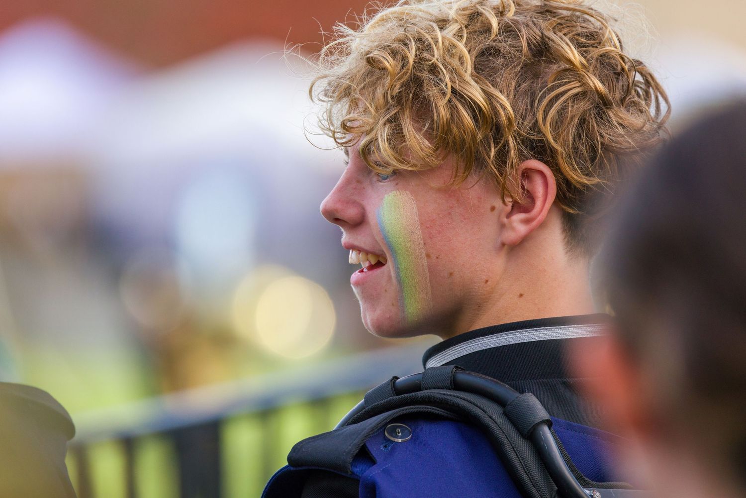 A row of seven similar still images displayed side by side showing curly blonde hair in sporting environments.