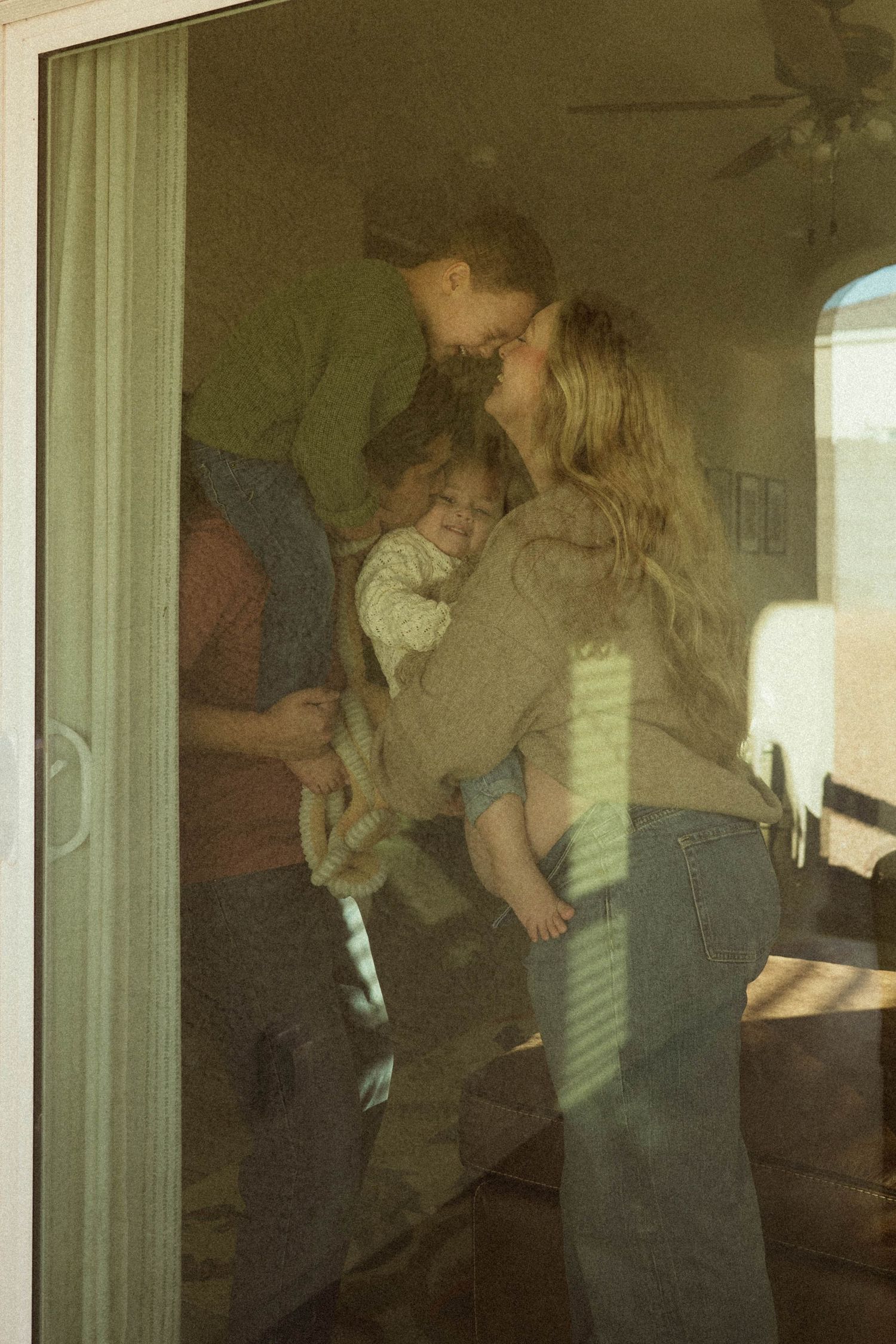 family hugging at their in home photo session in phoenix
