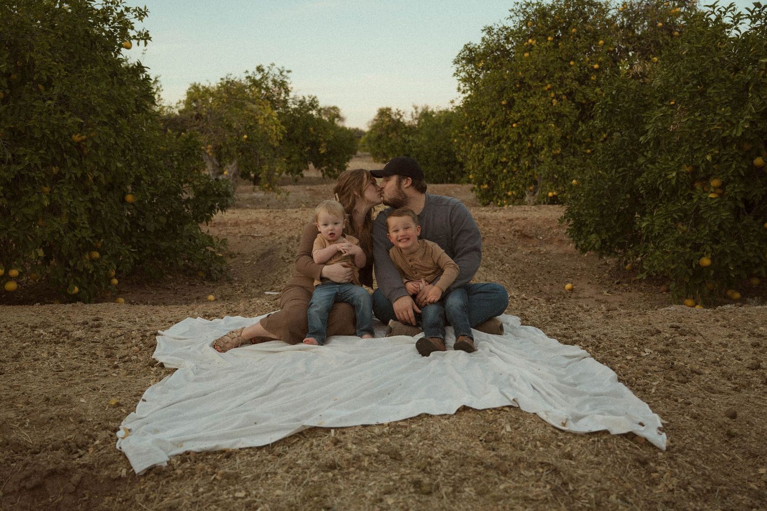 family during a laid back arizona orange grove session in phoenix