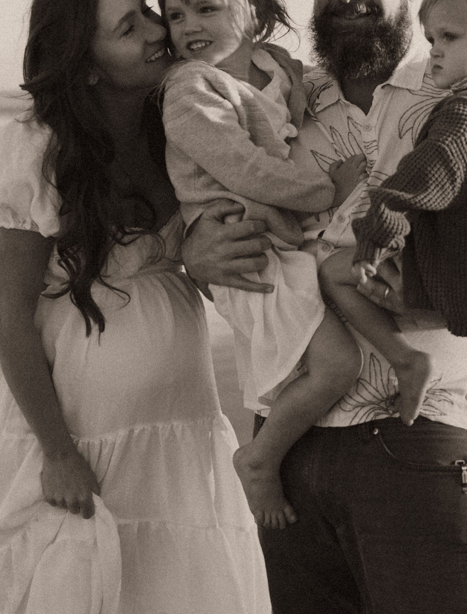 family snuggling together during their photoshoot in phoenix