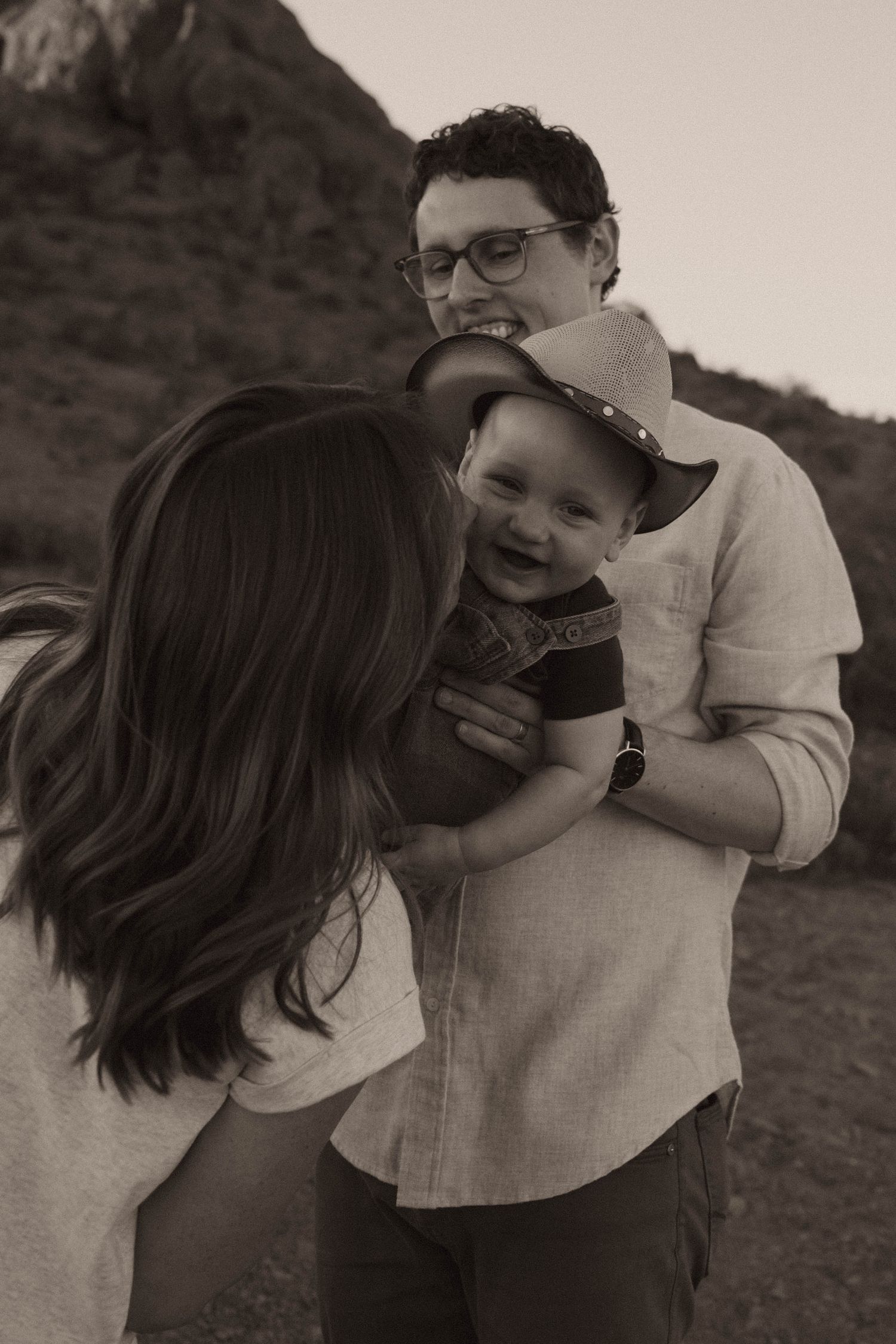 family with a baby enjoying desert scenery during their photoshoot in phoenix