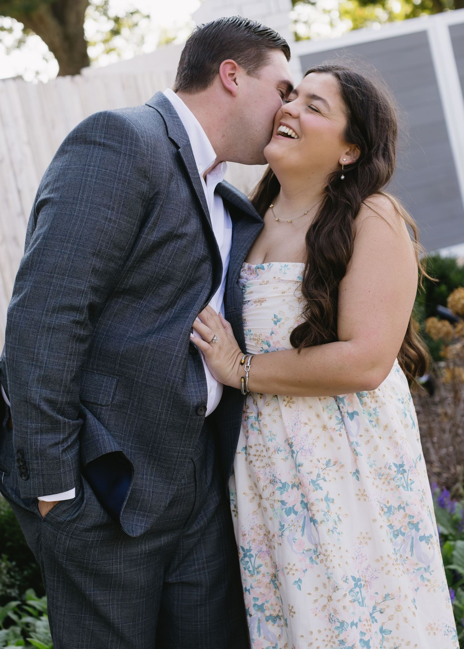 Happy couple shares romantic moments and laughter in a series of outdoor wedding portraits.