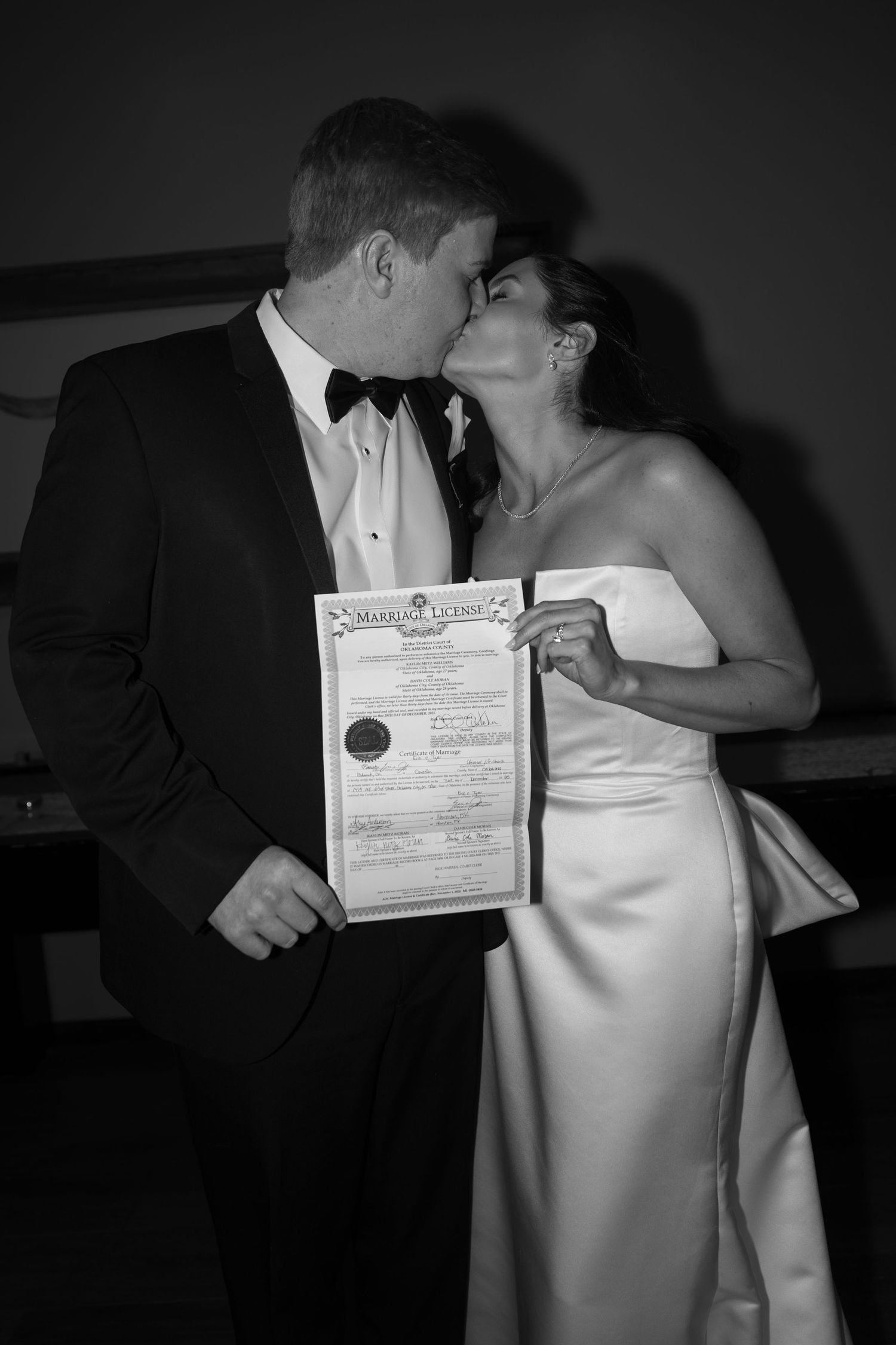 Black and white photos showing a couple with their marriage certificate.
