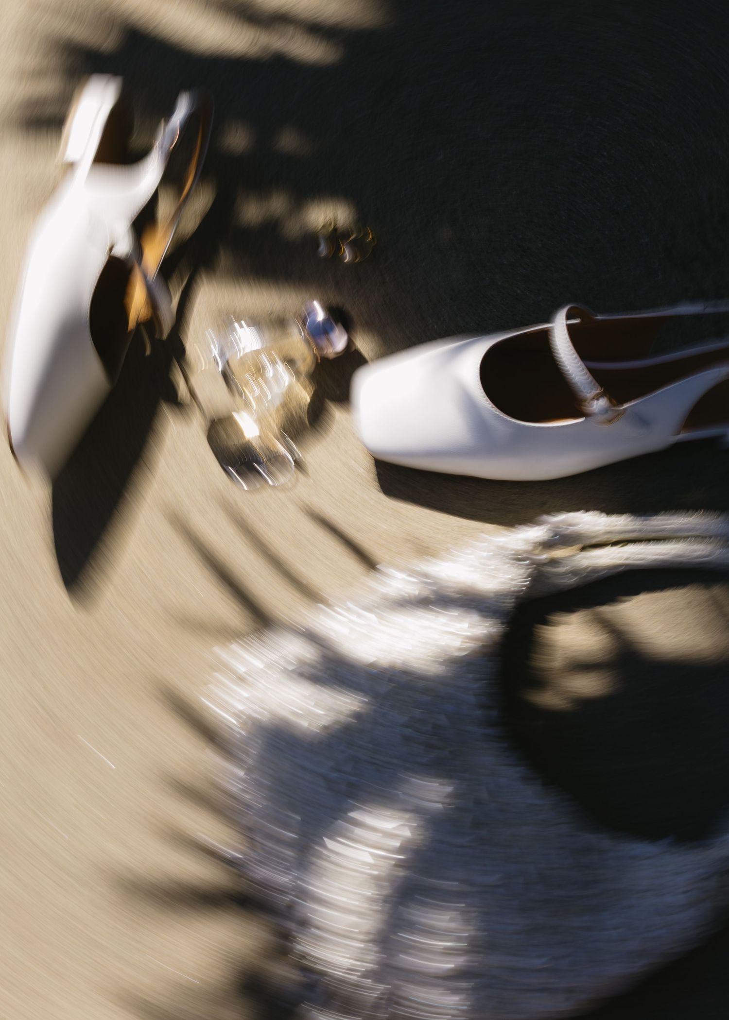 Motion-blurred dancing creates an artistic swirl of white and black on the dance floor.