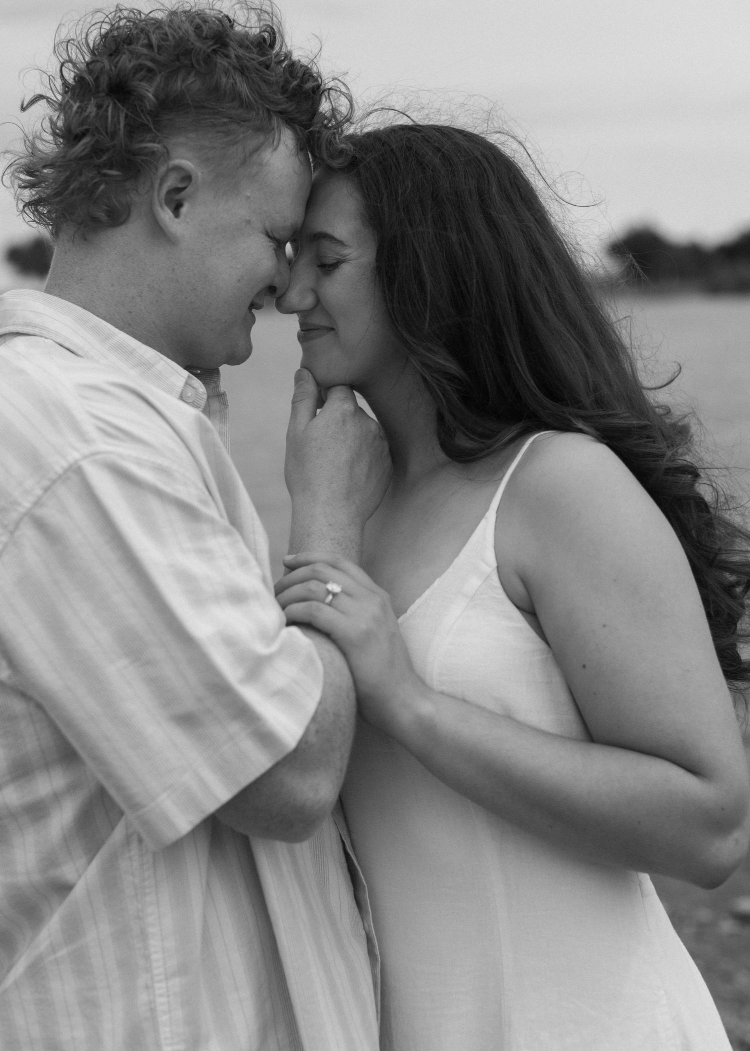 Close-up black and white shots of a tender romantic moment between a couple.