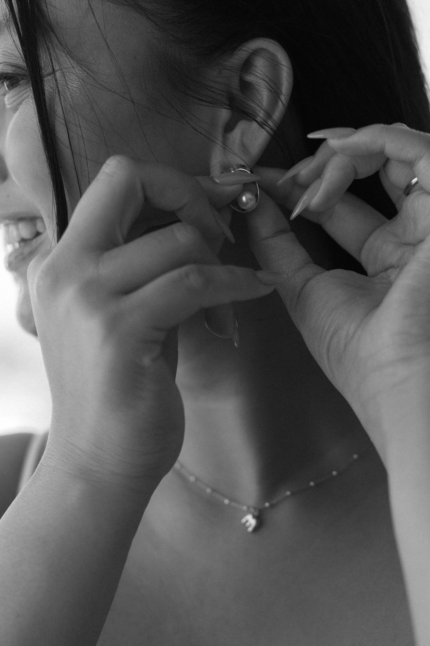 A romantic black and white photo series showing a couple sharing intimate moments and kisses.