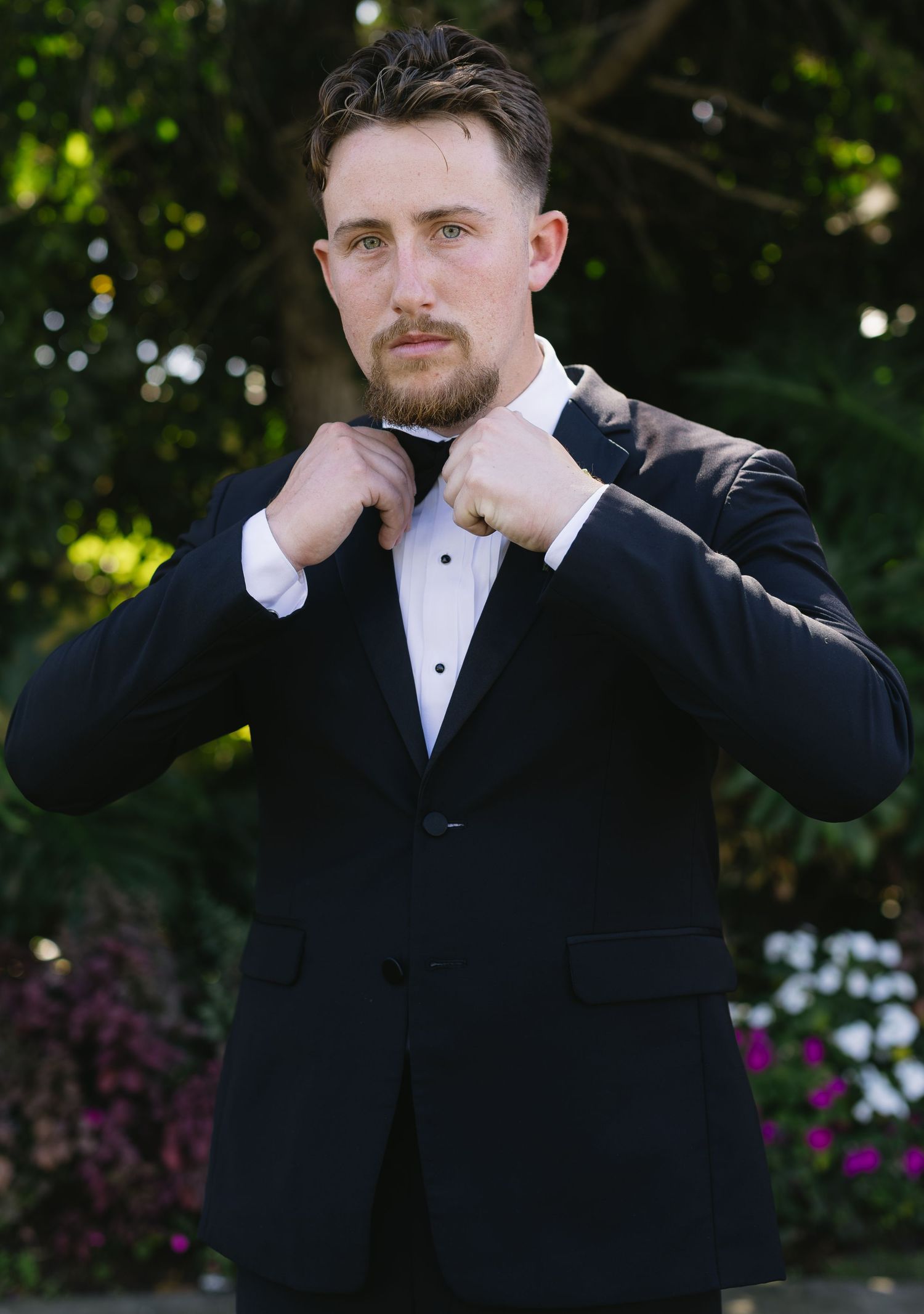 A sequence of photos showing a man in a tuxedo making silly faces at the camera.