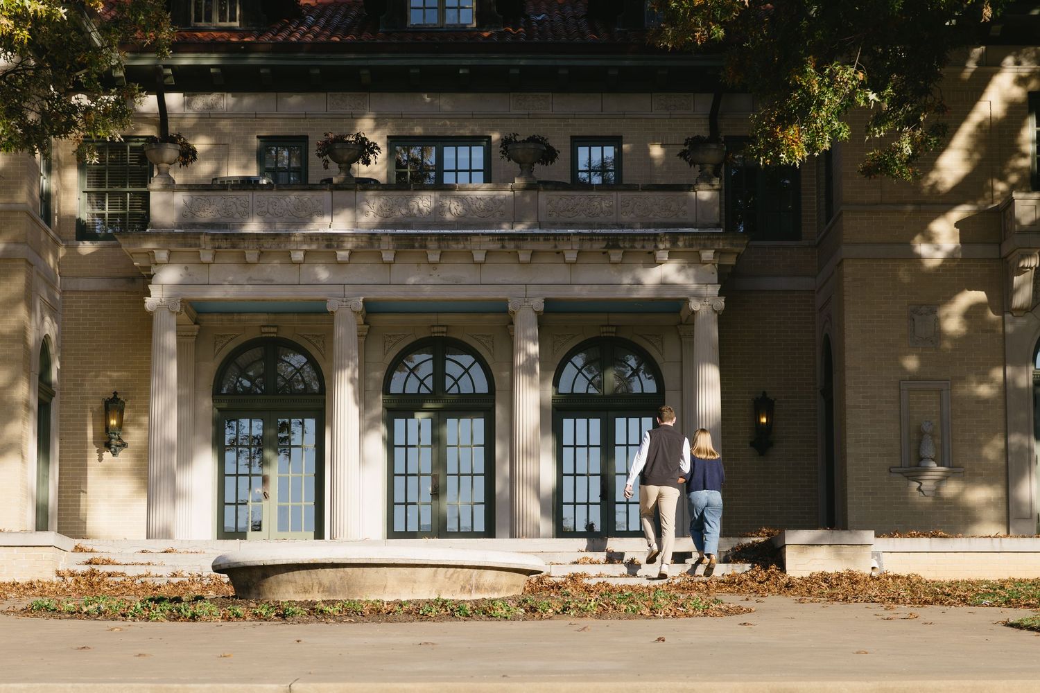 Architectural view of a classic building facade with arched windows and columns.