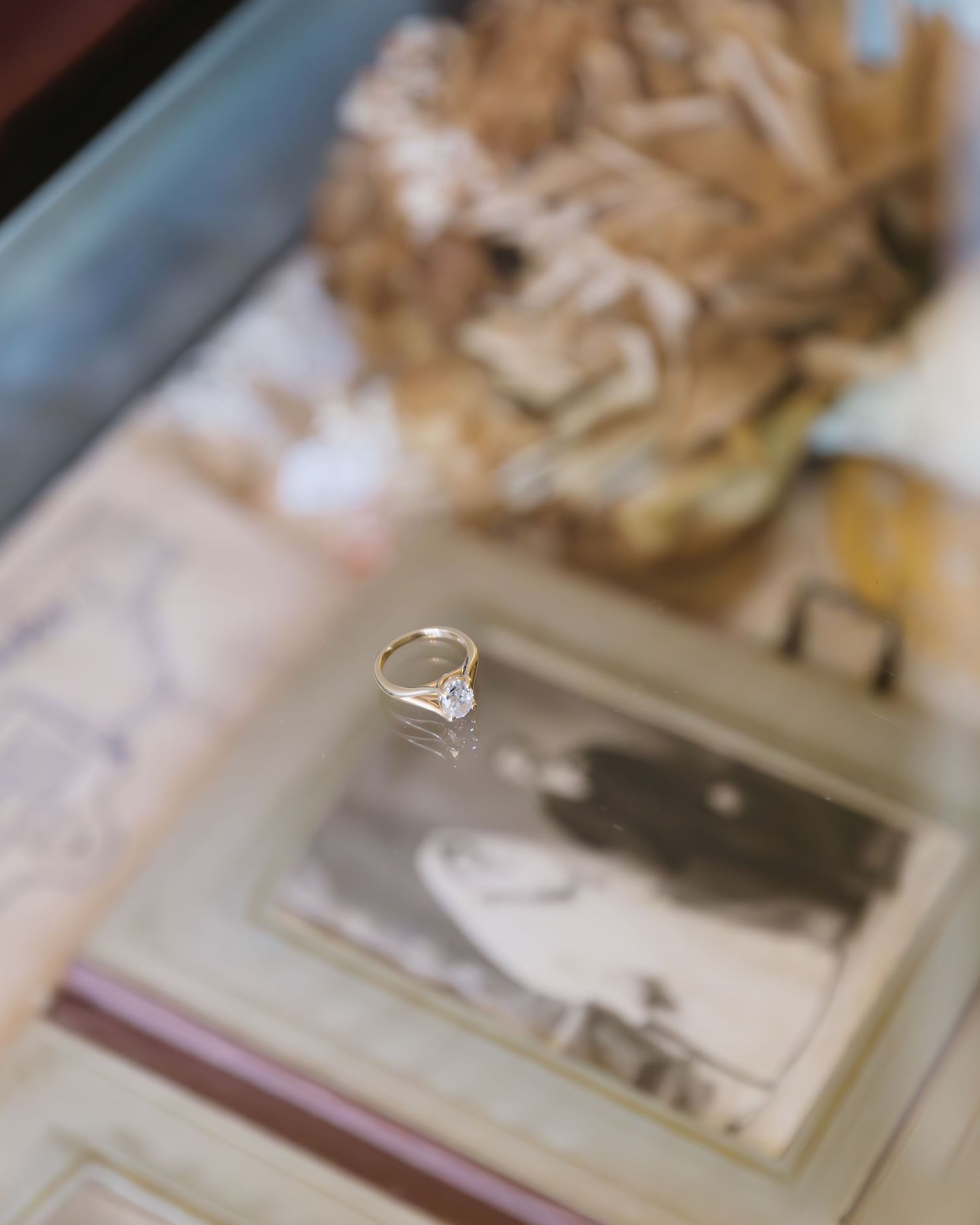 Vintage wedding photographs and memorabilia displayed as table decor.