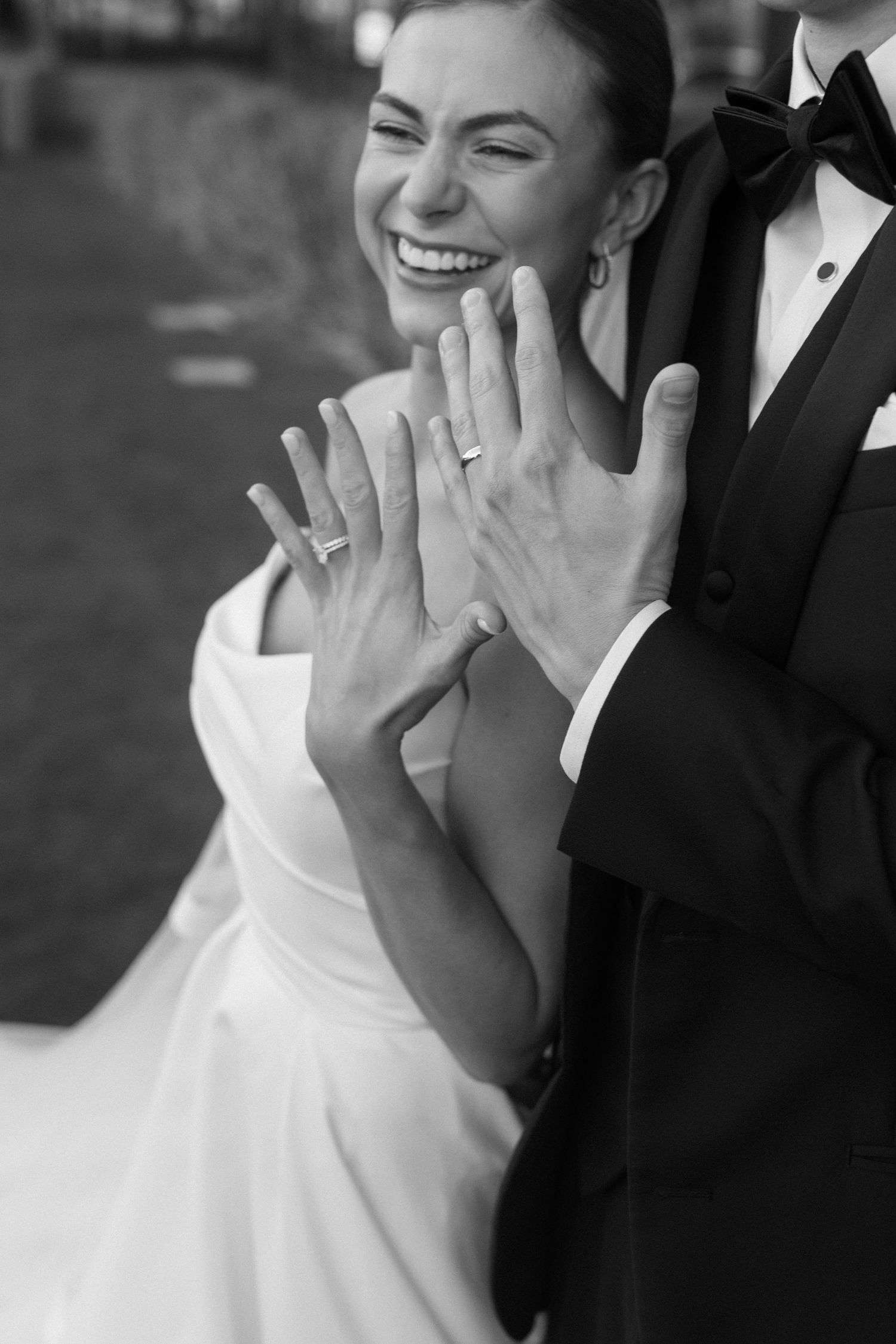 Black and white photo series showing a bride's joyful laughter and emotional reactions during a wedding moment.