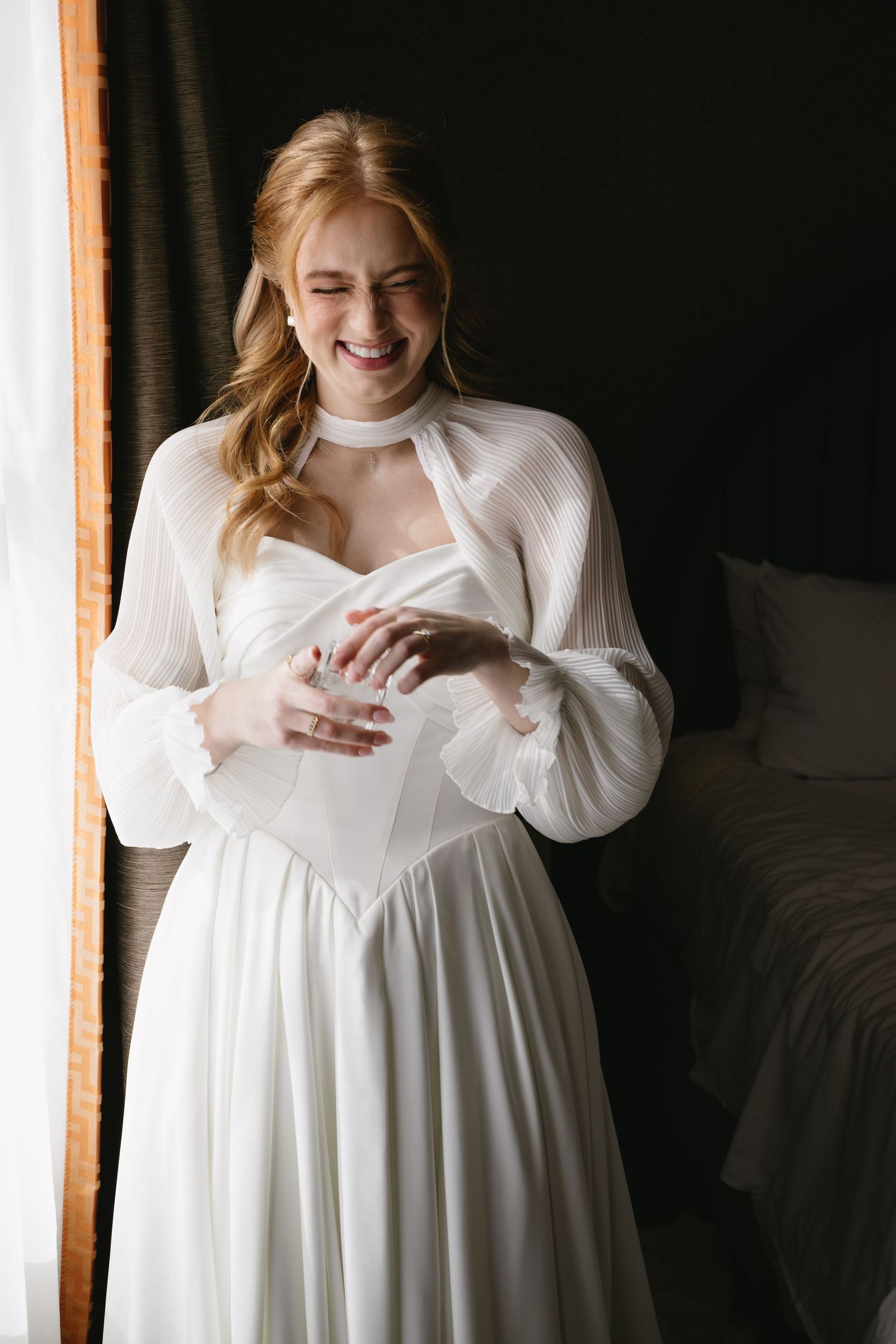 A sequence of joyful moments captured in a white flowy dress against a dark background.