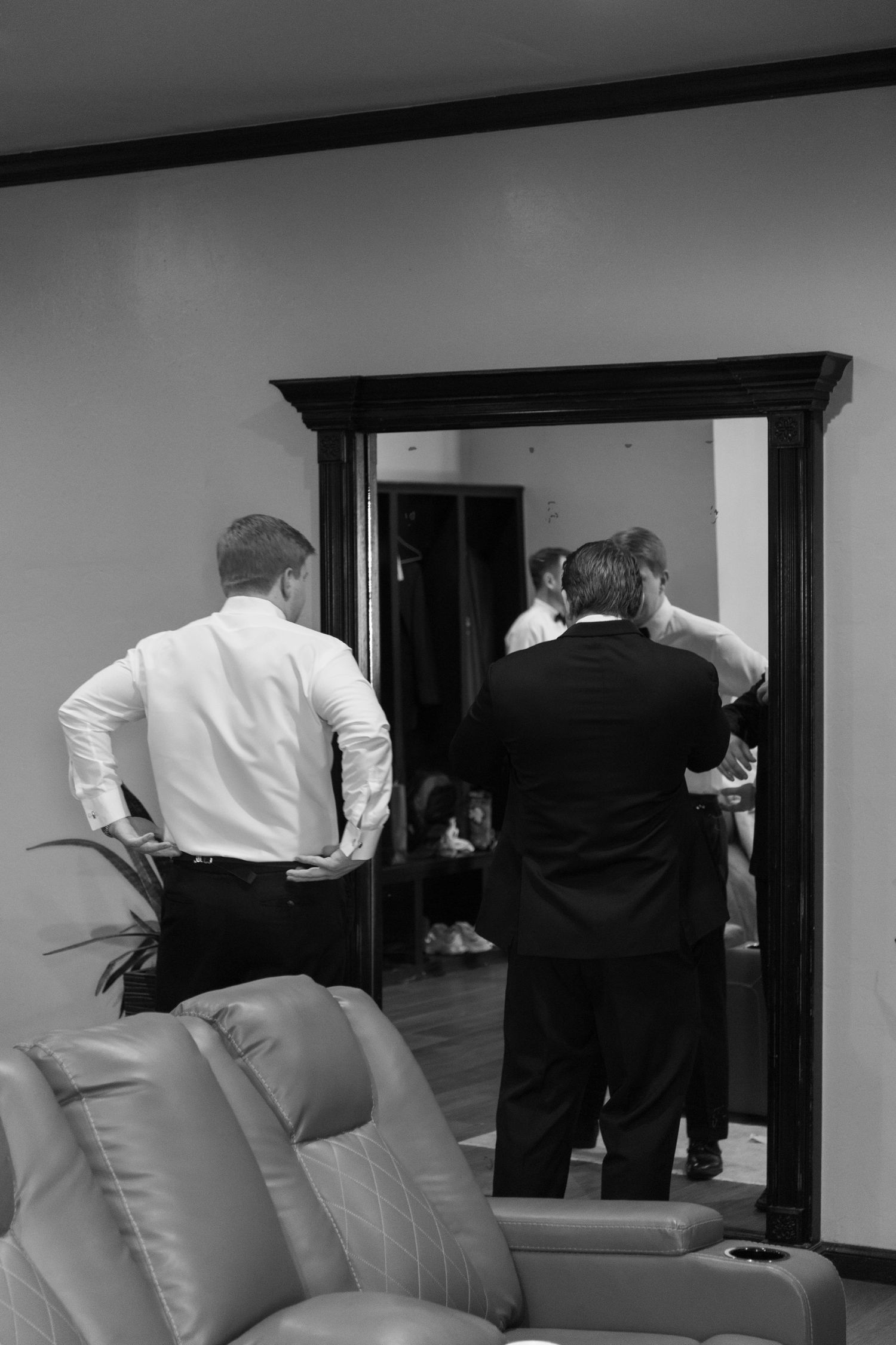 Black and white photos showing people in formal attire moving through doorways and interior spaces.