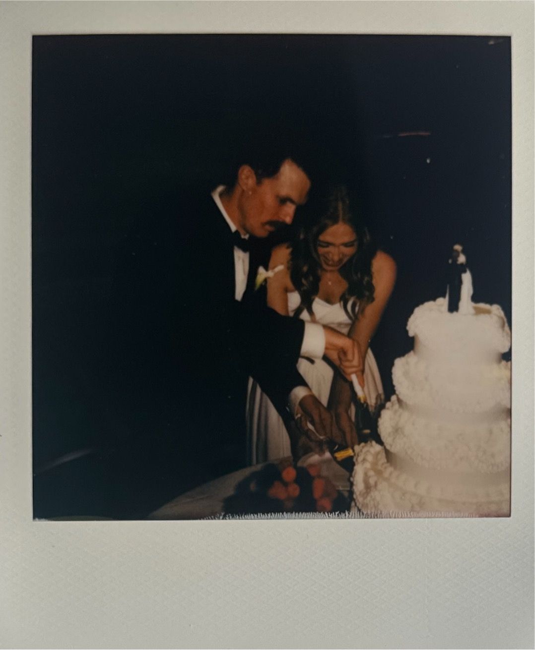 Dark vintage-style polaroid photos showing wedding moments.