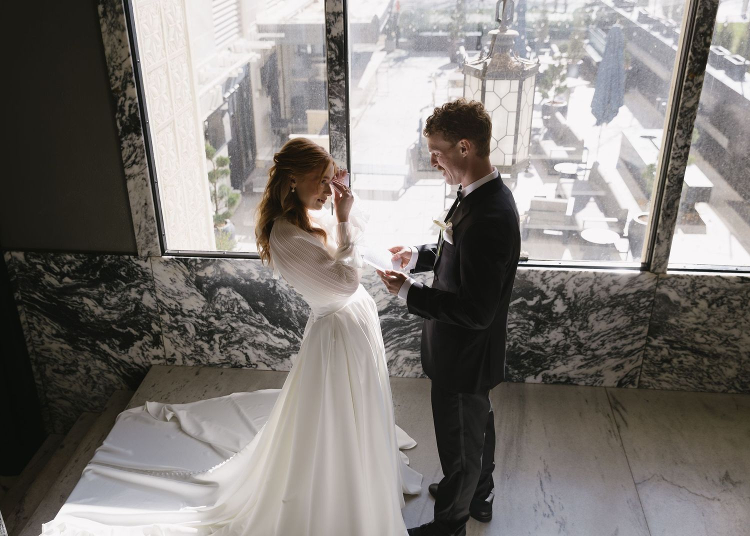 A series of wedding photographs showing intimate moments between a bride and young attendant near bright windows.