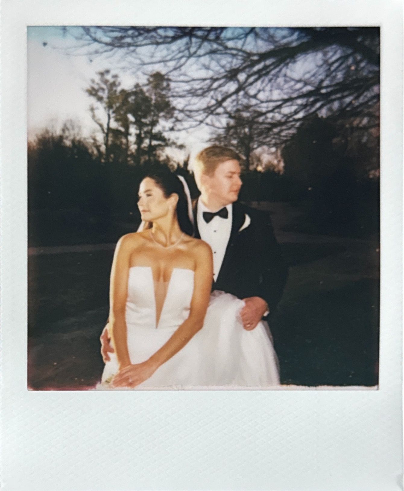Polaroid-style wedding photos showing couple in outdoor setting.