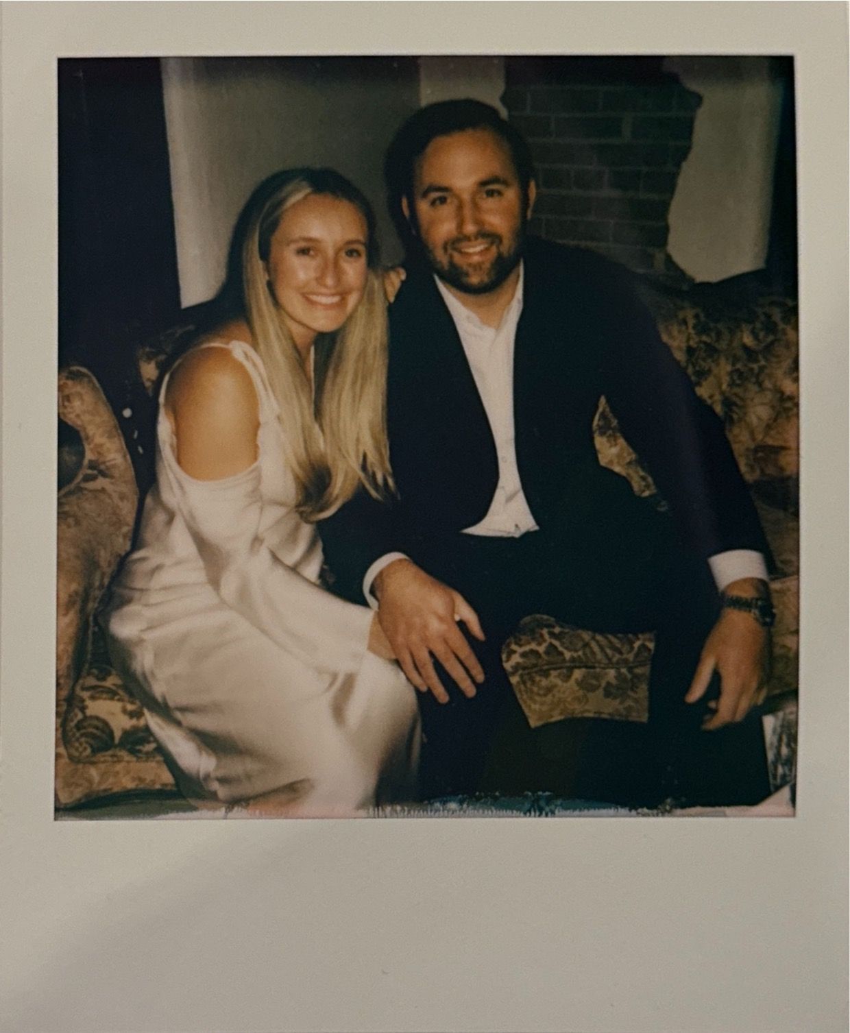 Vintage polaroid-style photos arranged in a row showing a couple sitting together on what appears to be a sofa.