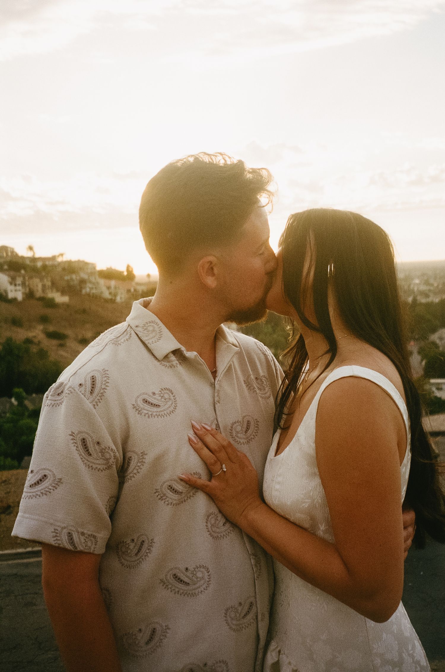 A romantic couple shares tender moments at sunset in a series of connected photos.